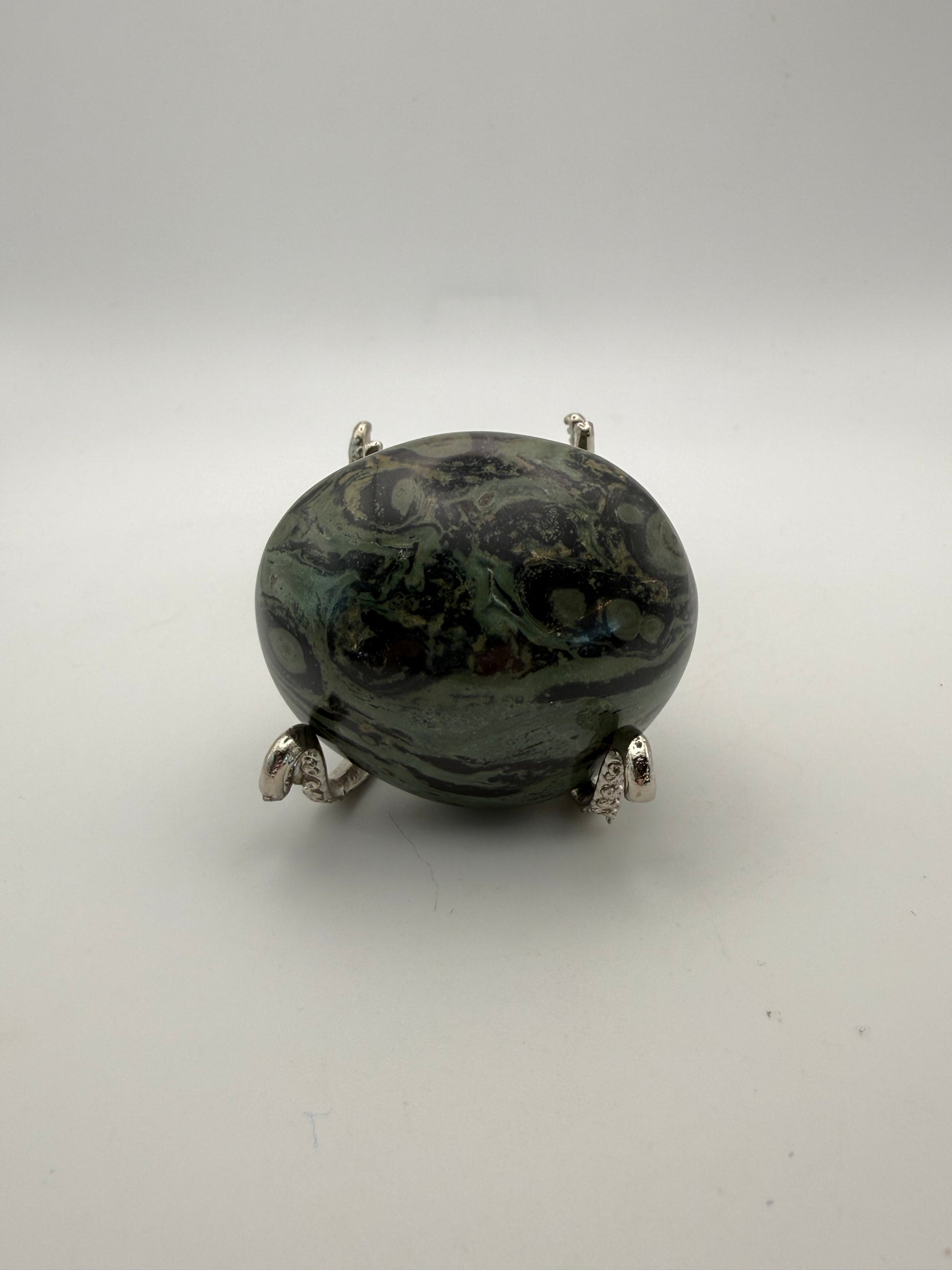 Polished kambaba jasper palm stone.