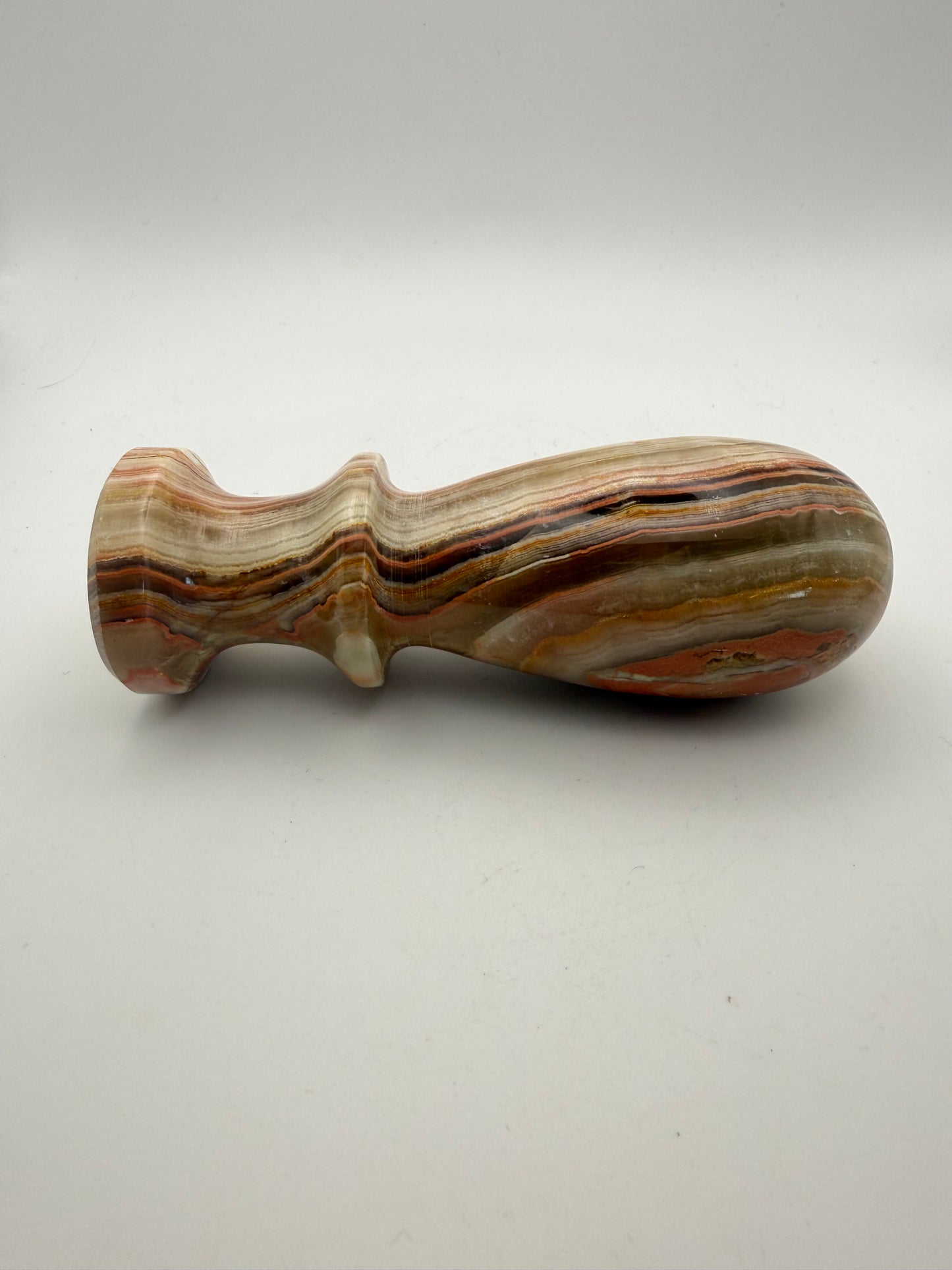 Mortar and pestle made out of onyx stone.