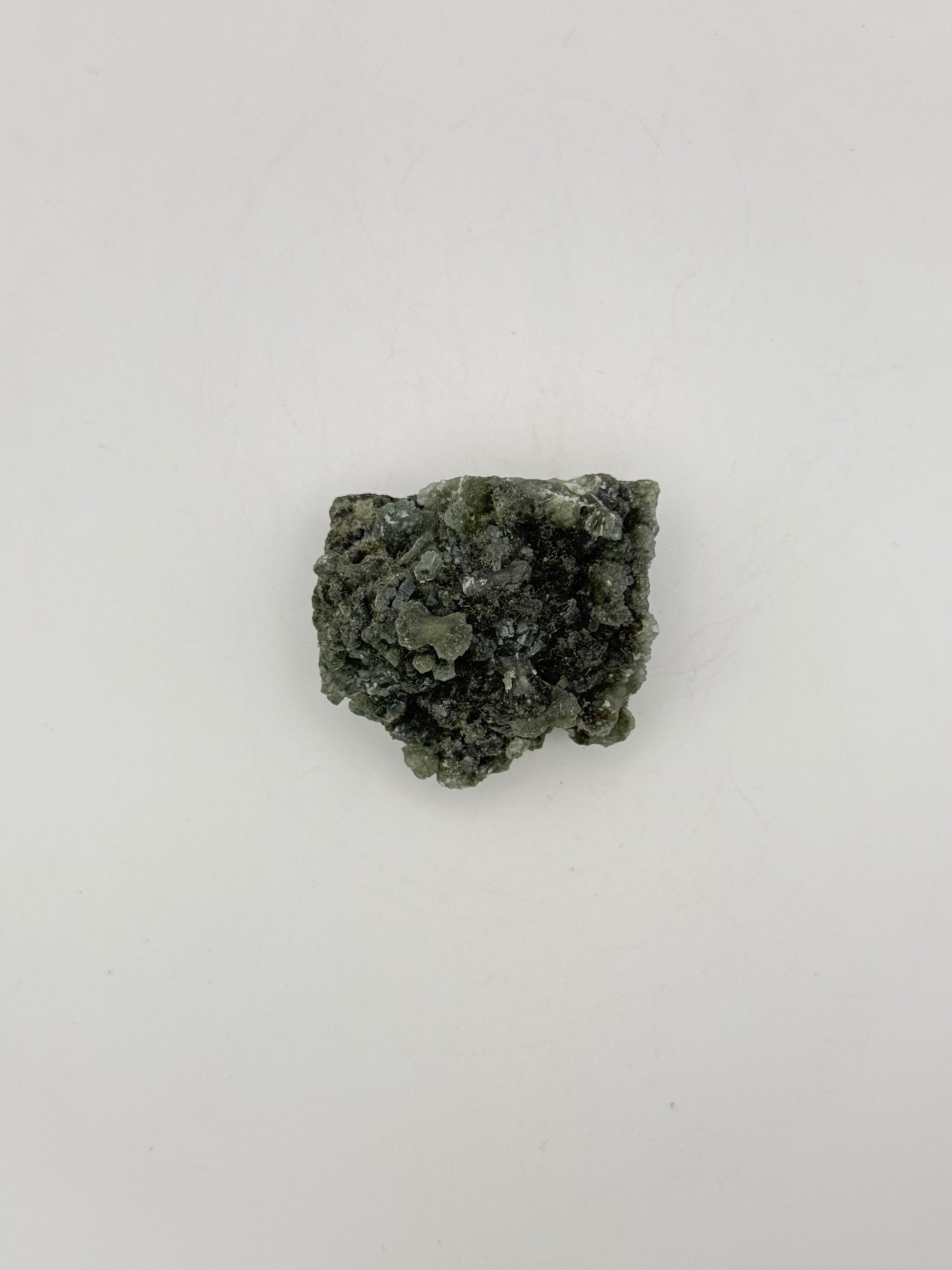 Raw Prehnite specimen with amazing green color.