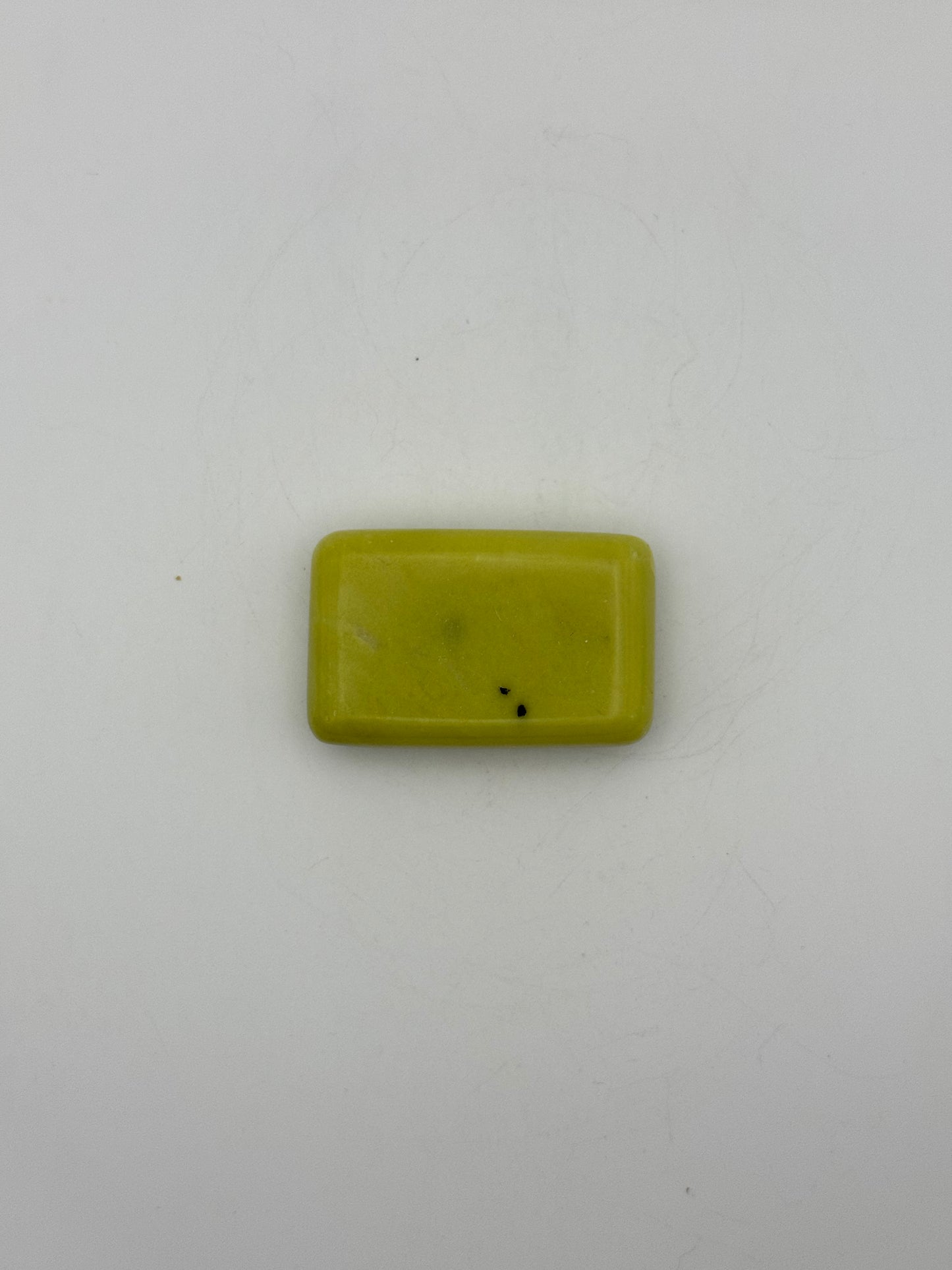 Polished healerite in the shape of a rectangular soap.