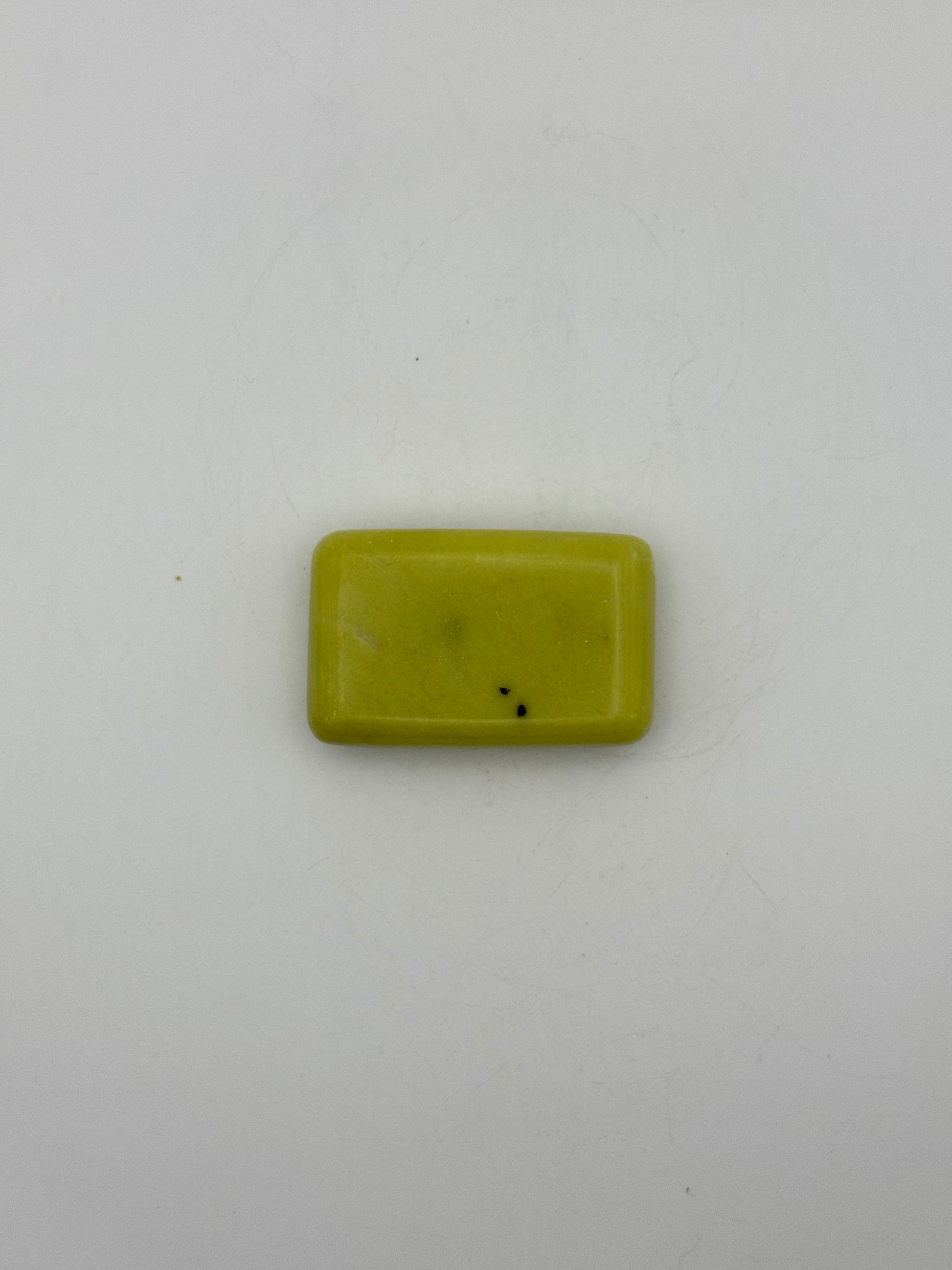 Polished healerite in the shape of a rectangular soap.