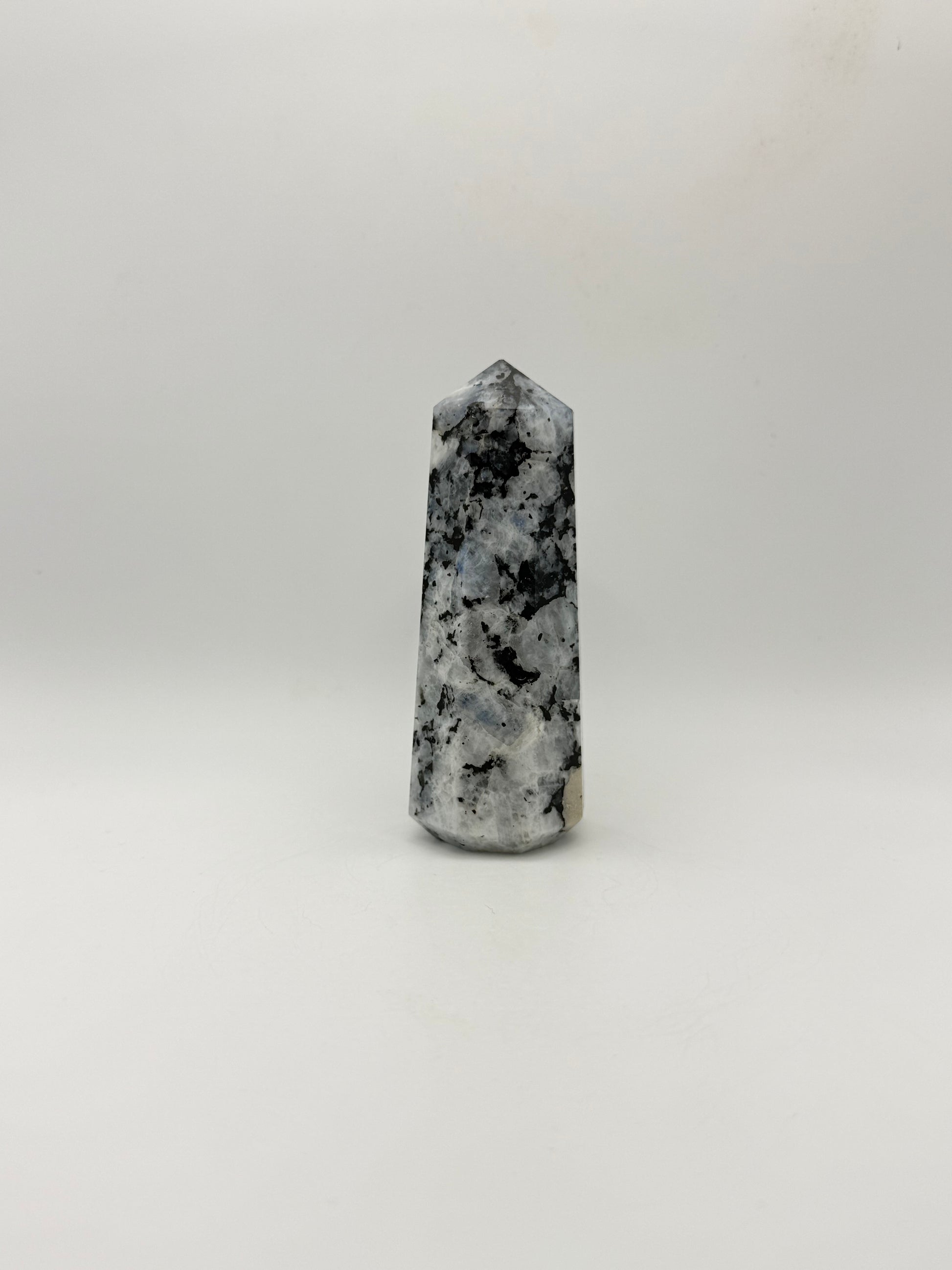 Polished rainbow moonstone tower with nice flashes of blue.