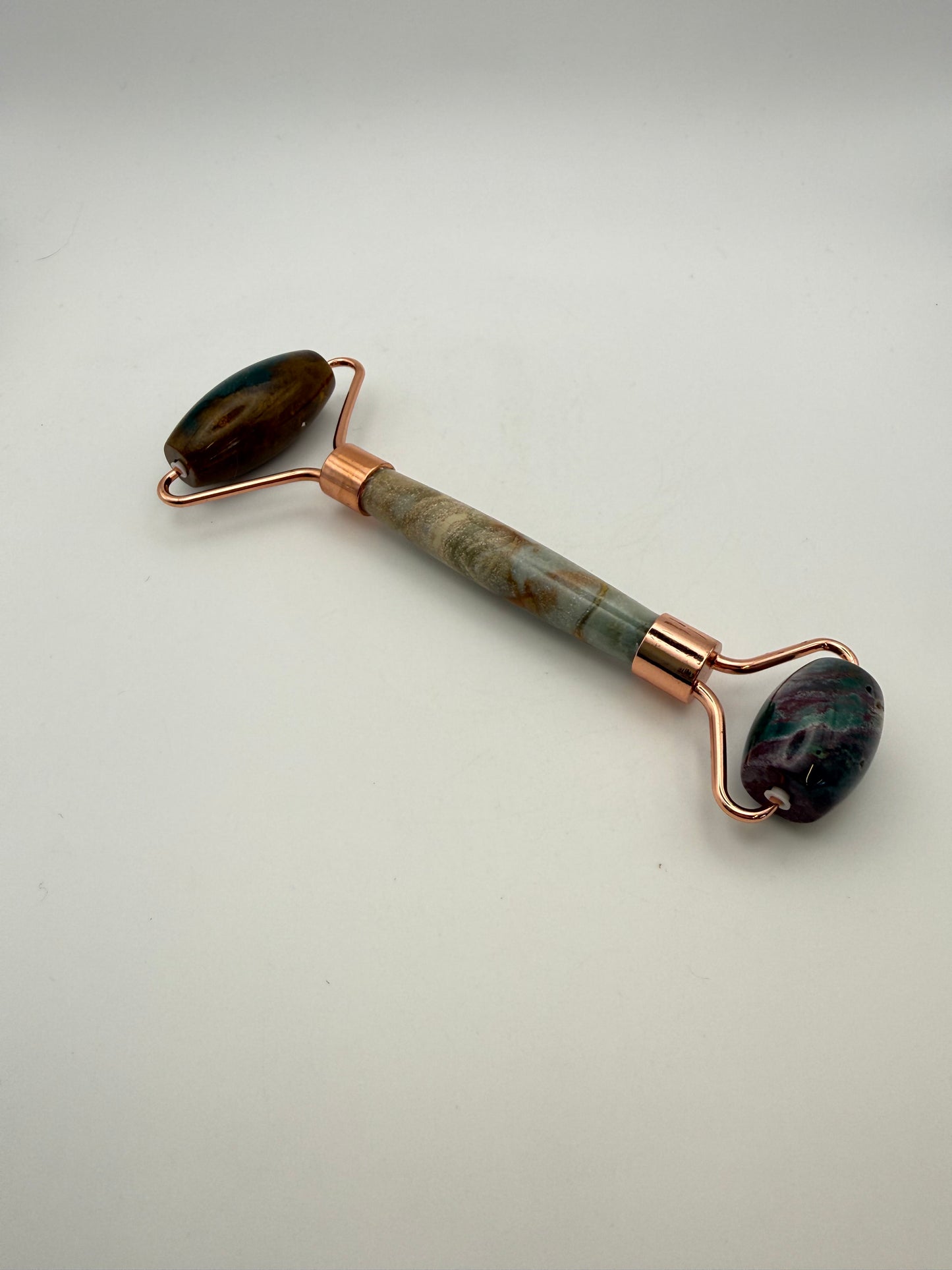Massage roller made from ocean jasper stone.