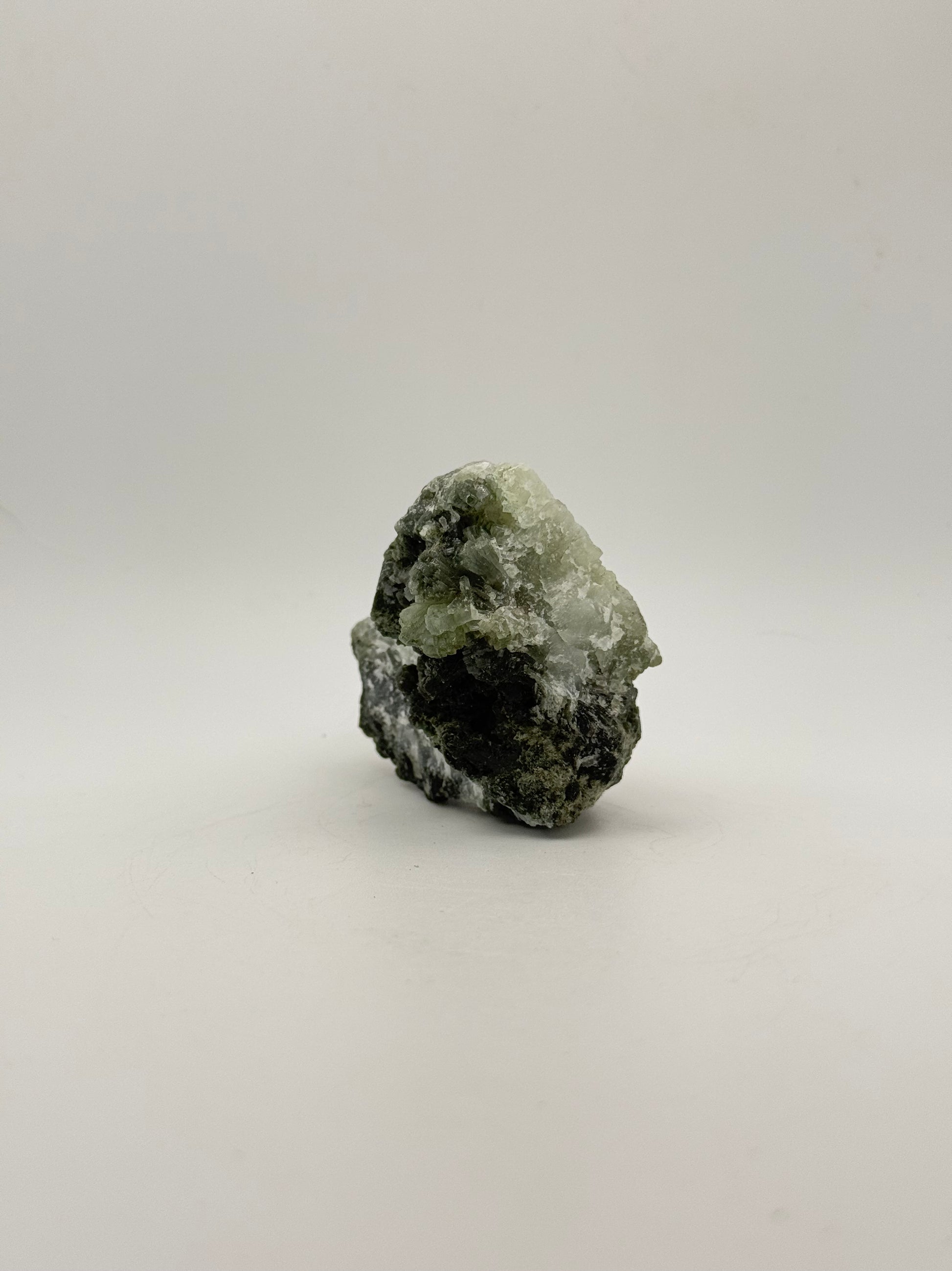 Raw Prehnite specimen with amazing green color.