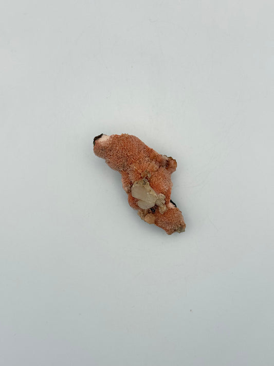 Raw Messolite crystal.