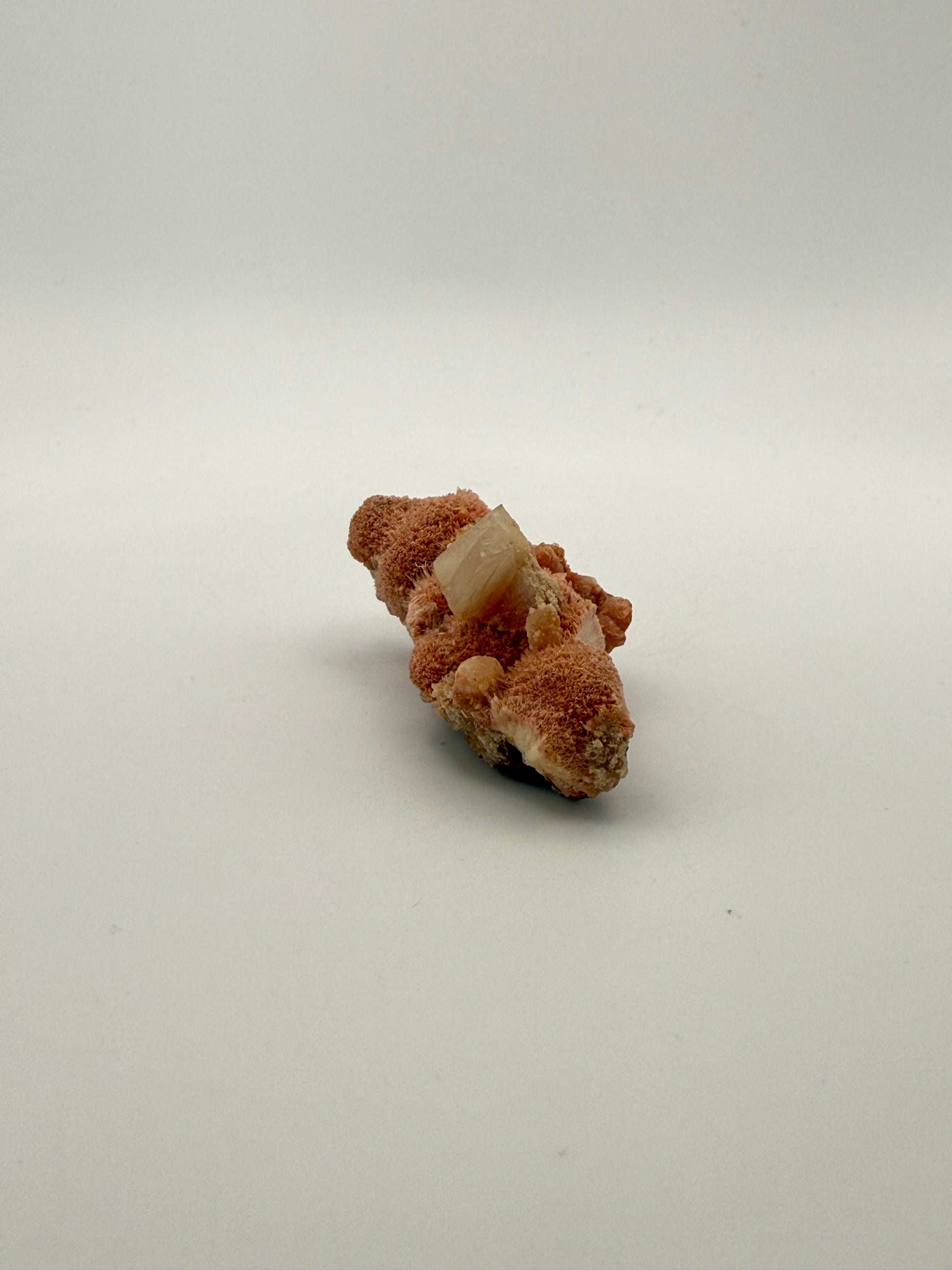 Raw Messolite crystal.