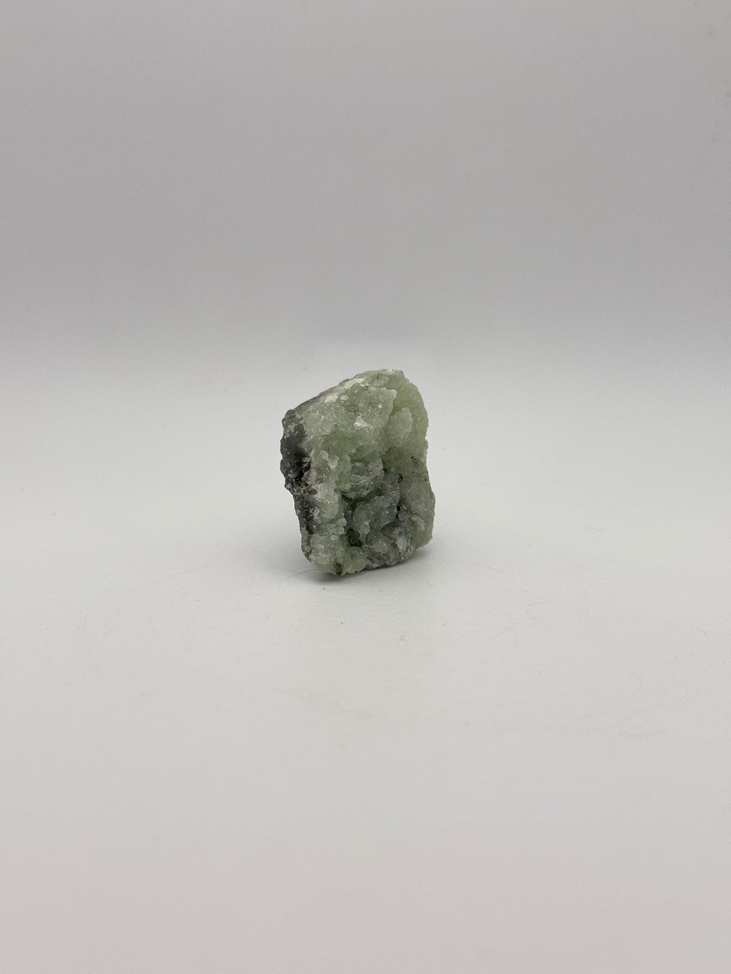 Raw prehnite specimen with amazing green color.