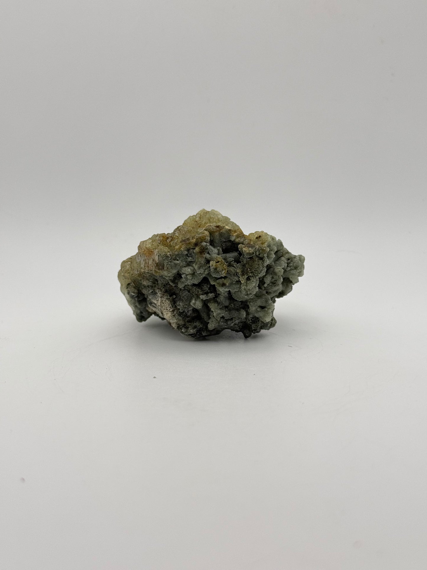 Raw Prehnite specimen with amazing green color.