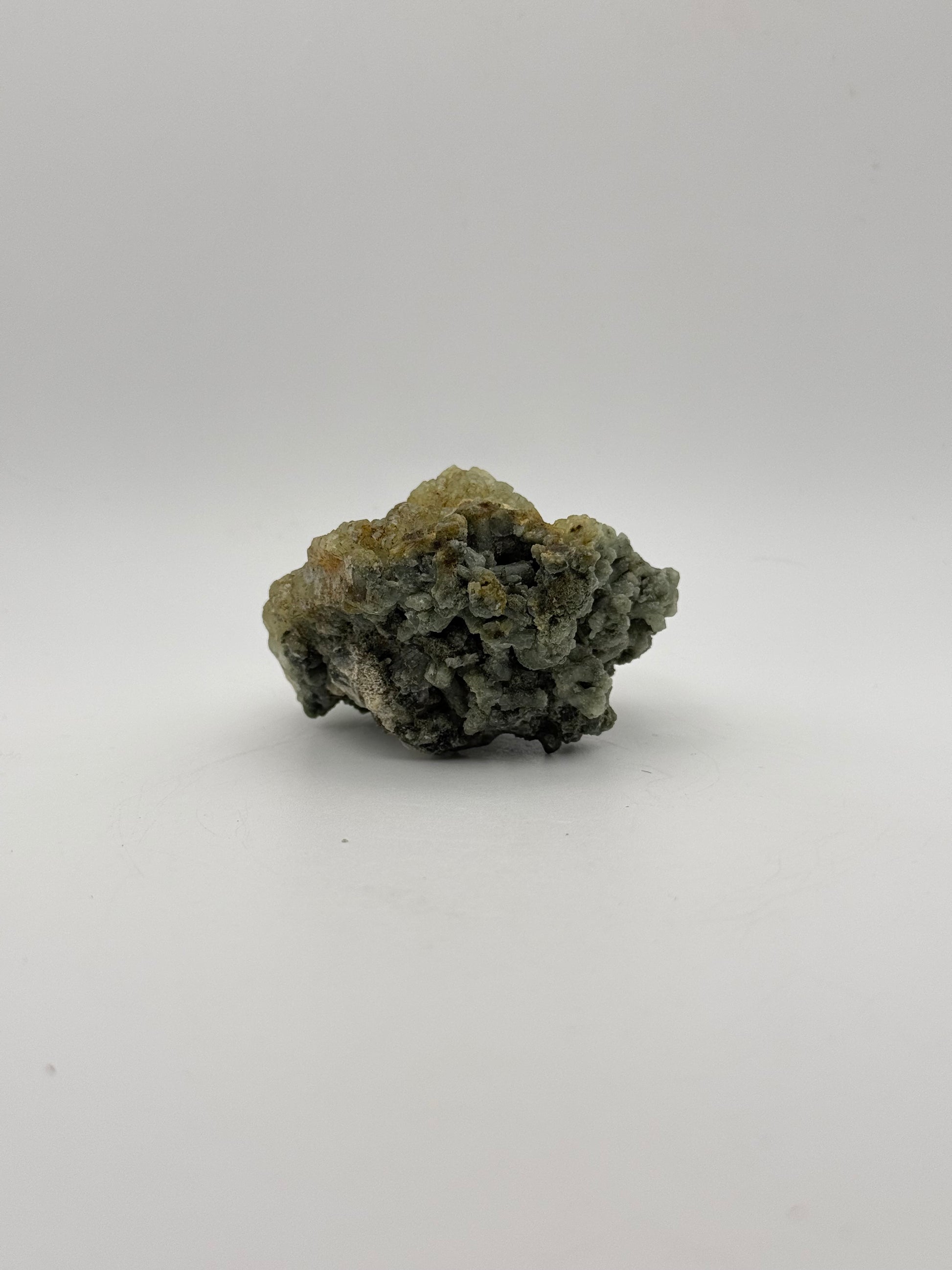 Raw Prehnite specimen with amazing green color.