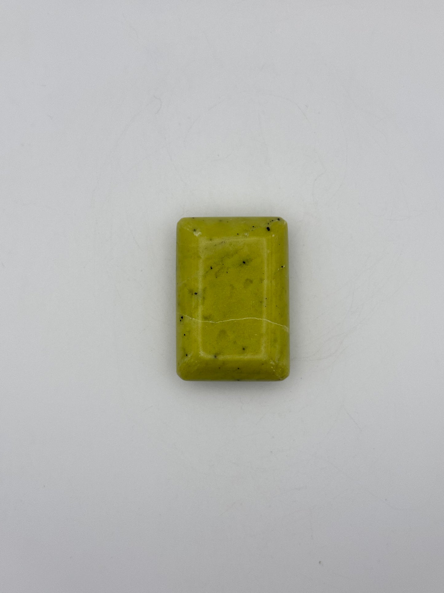 Polished healerite in the shape of a rectangular soap.