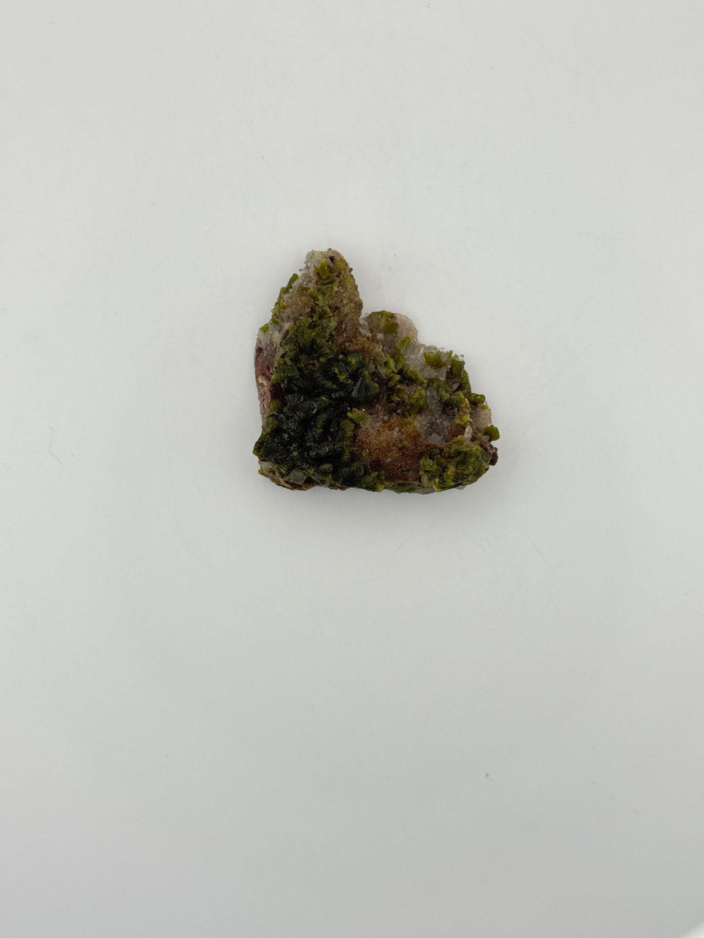 Epidote crystal cluster with good green color.