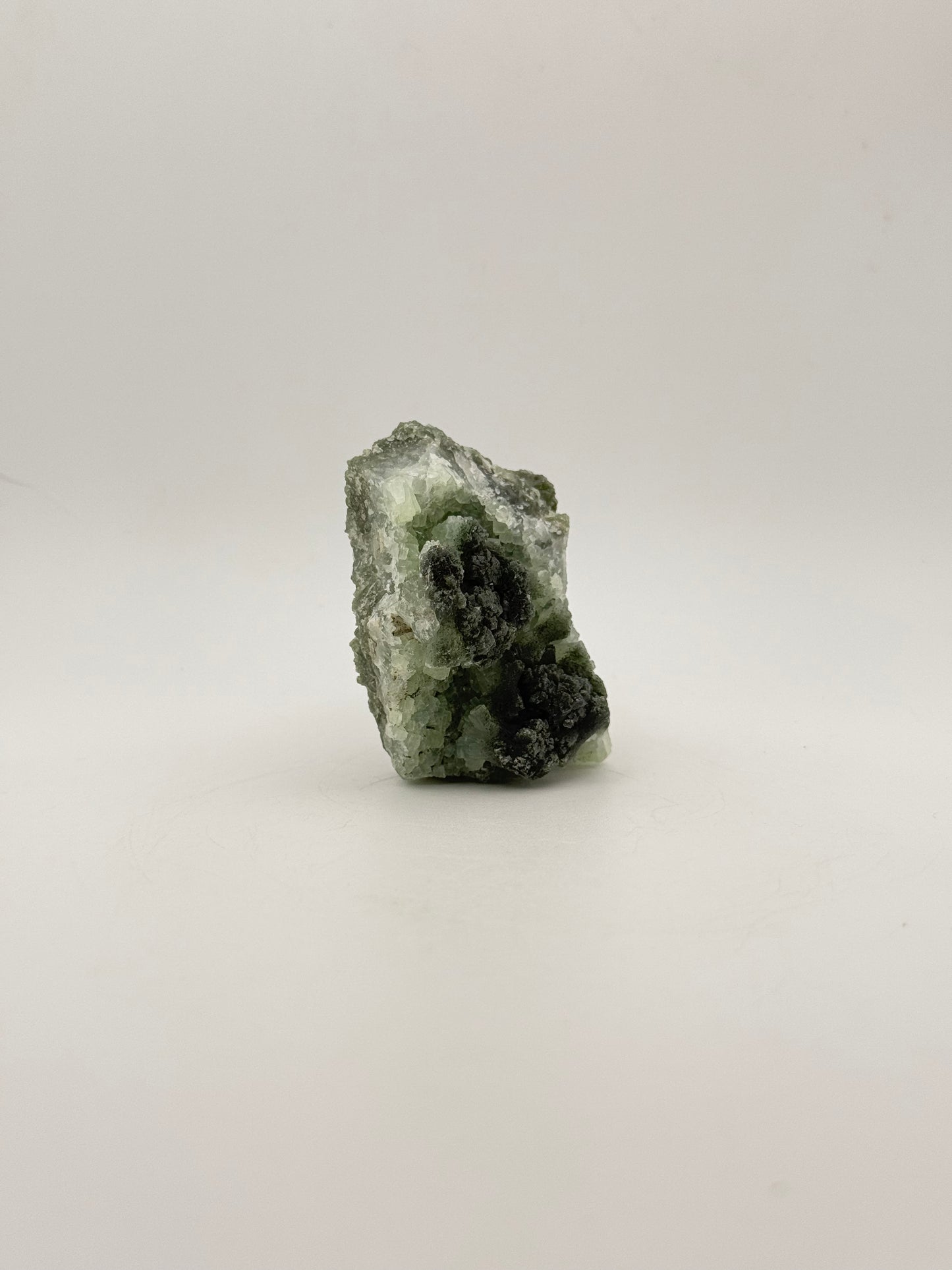 Raw Prehnite specimen with amazing green color.