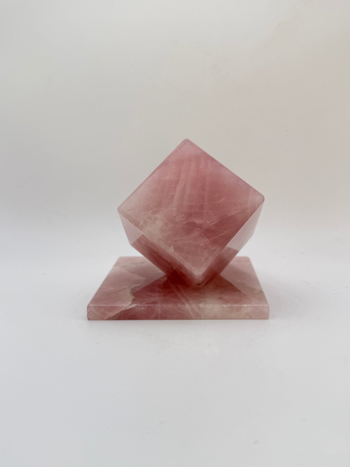 Polished rose quartz cut cube.
