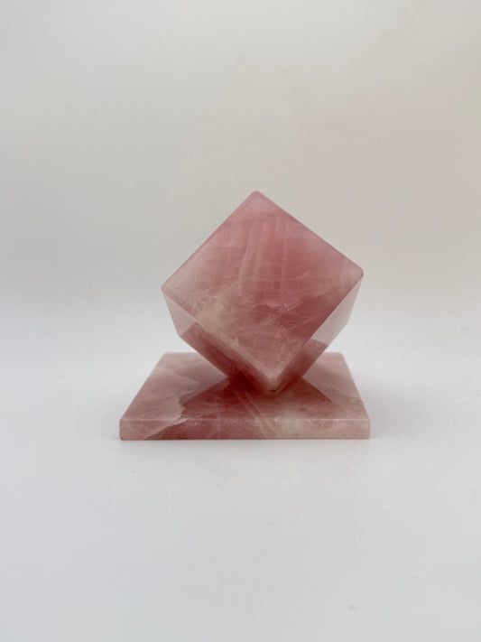 Polished rose quartz cut cube.