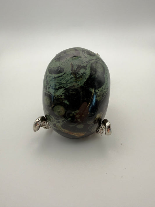 Polished kambaba jasper palm stone.