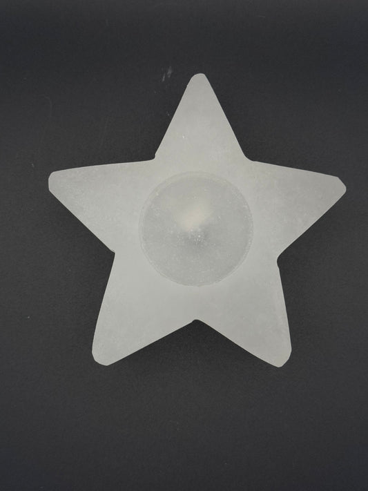 Star-shaped selenite candle holder.