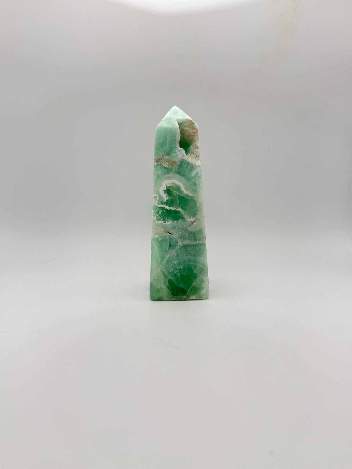 Caribbean Calcite polished four sided tower. This is 4.75 inches tall.