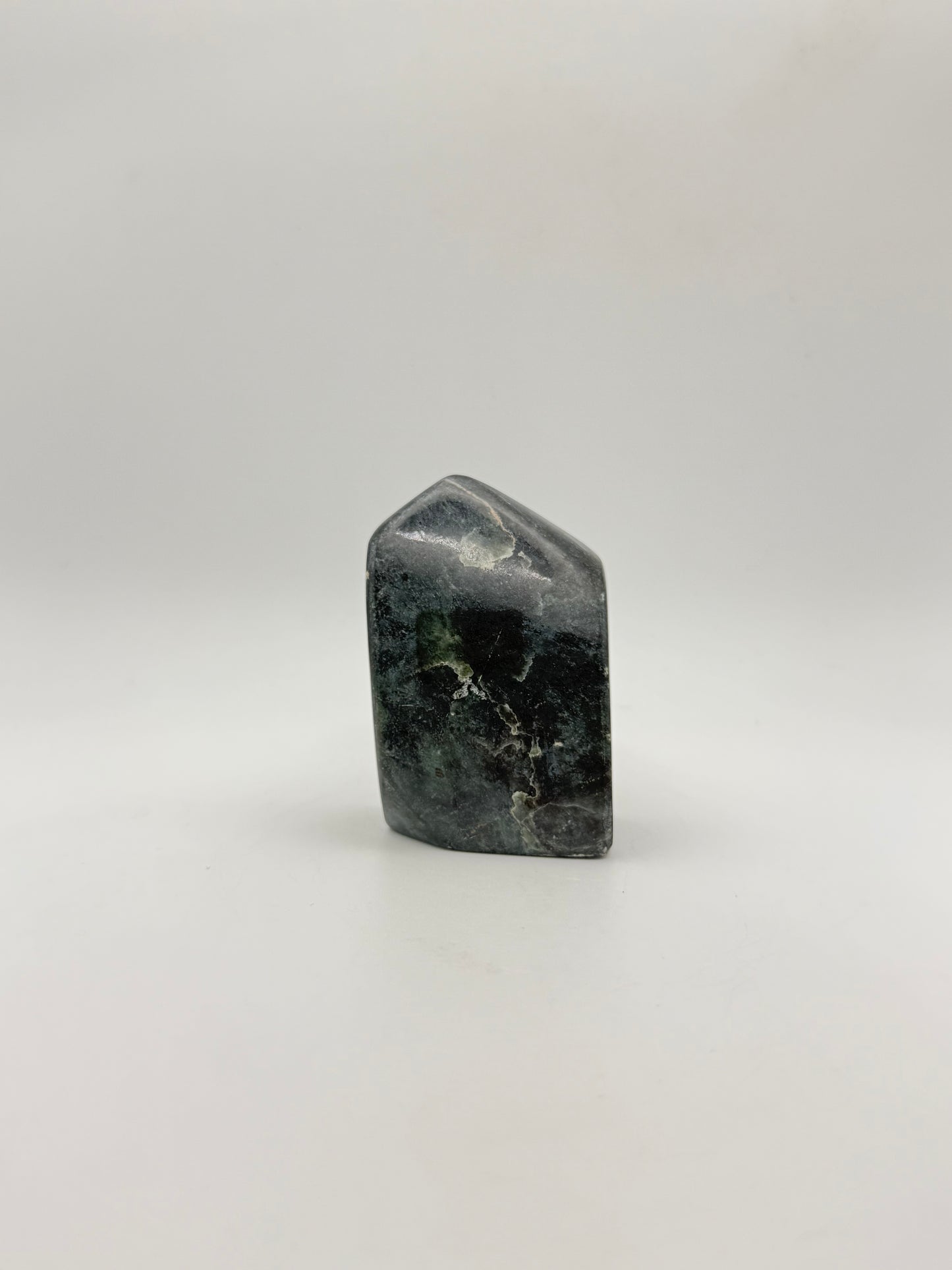 Polished green jade free form.