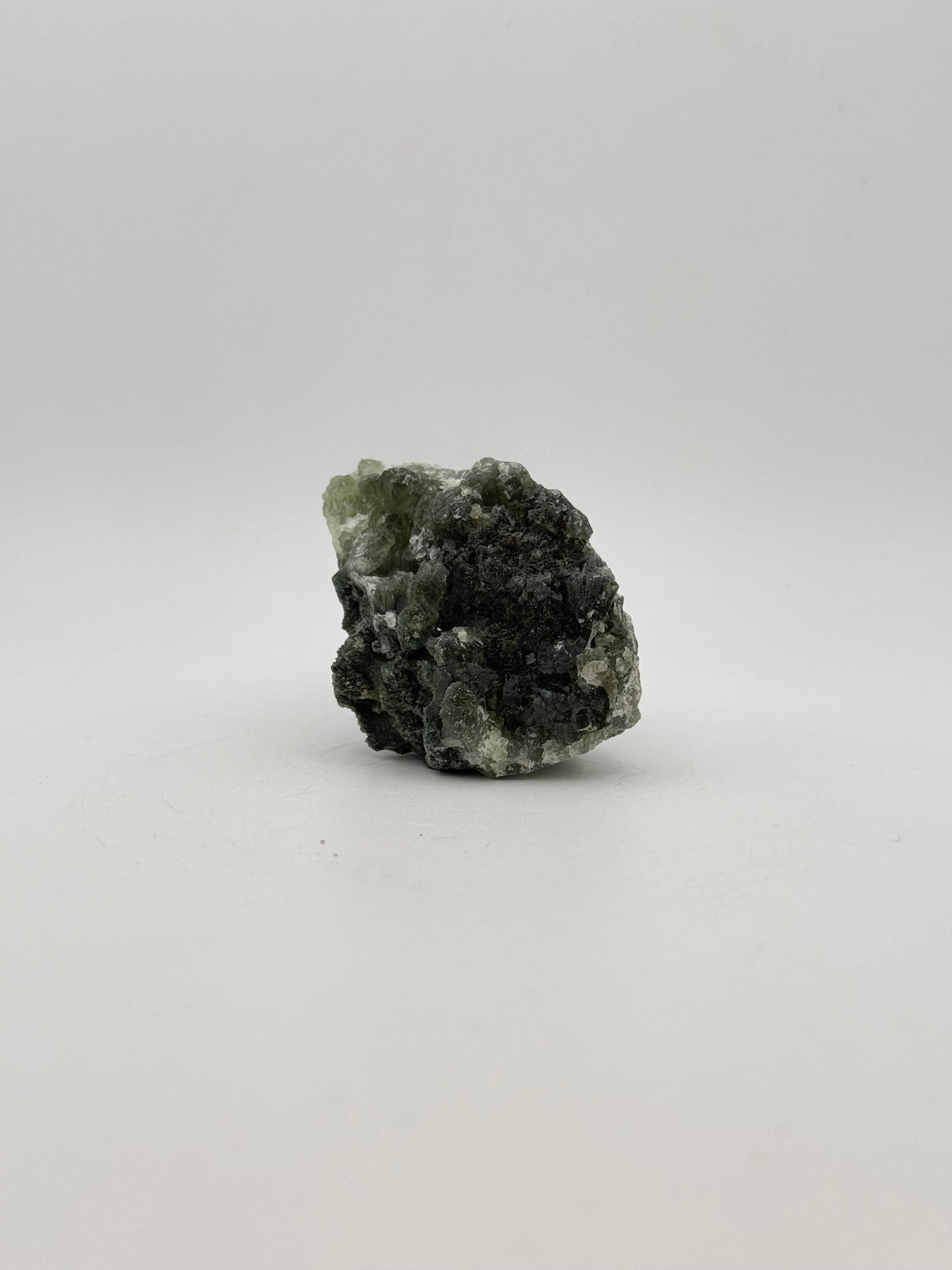 Raw Prehnite specimen with amazing green color.