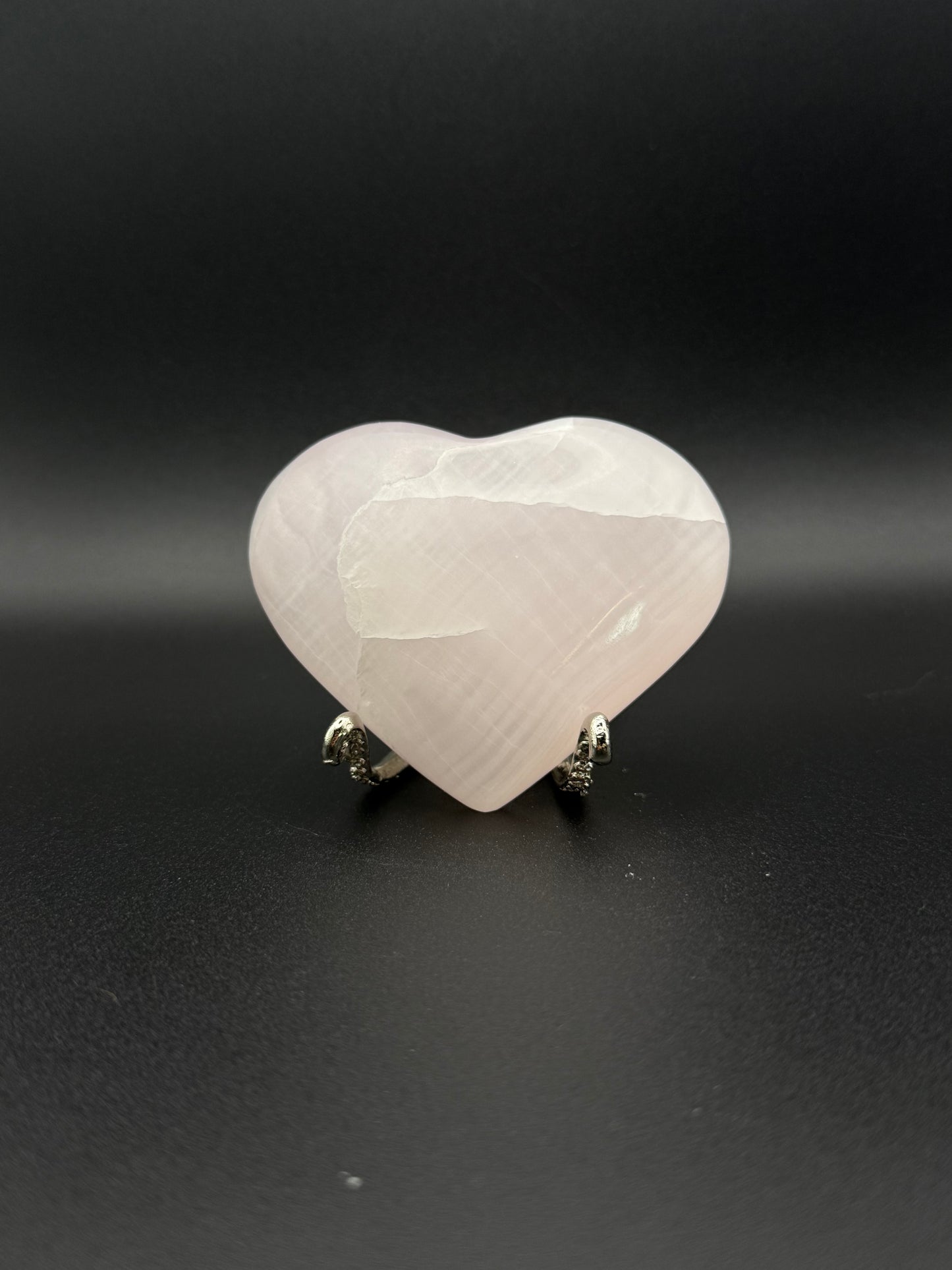Polished Pink Calcite heart. Pink calcite is uv reactive.