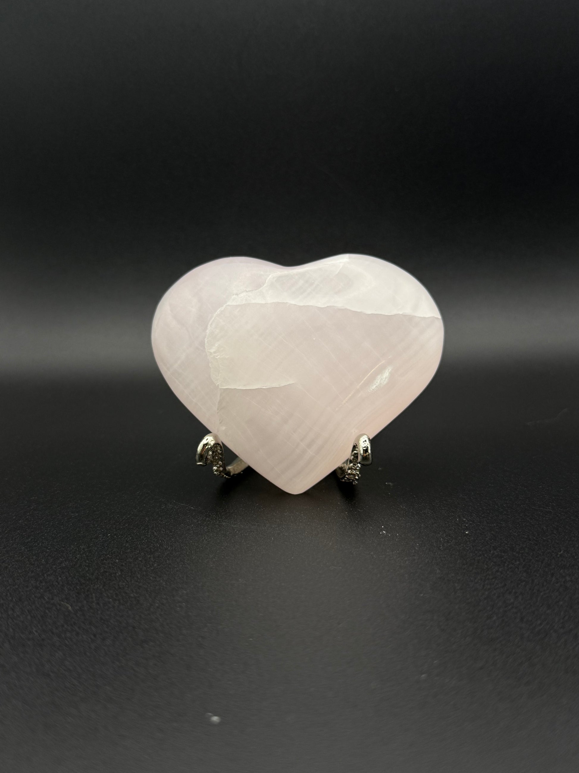 Polished Pink Calcite heart. Pink calcite is uv reactive.