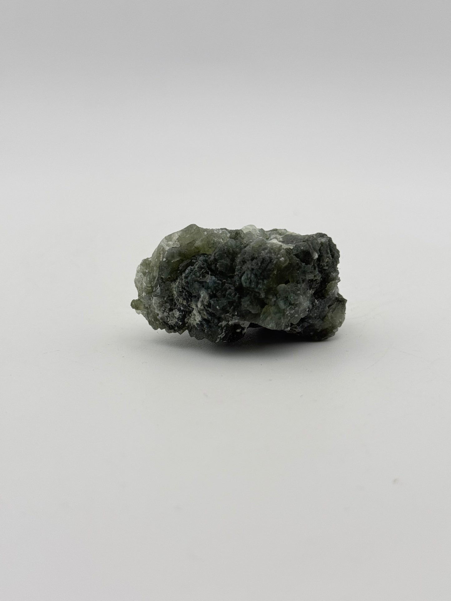 Raw Prehnite specimen with amazing green color.