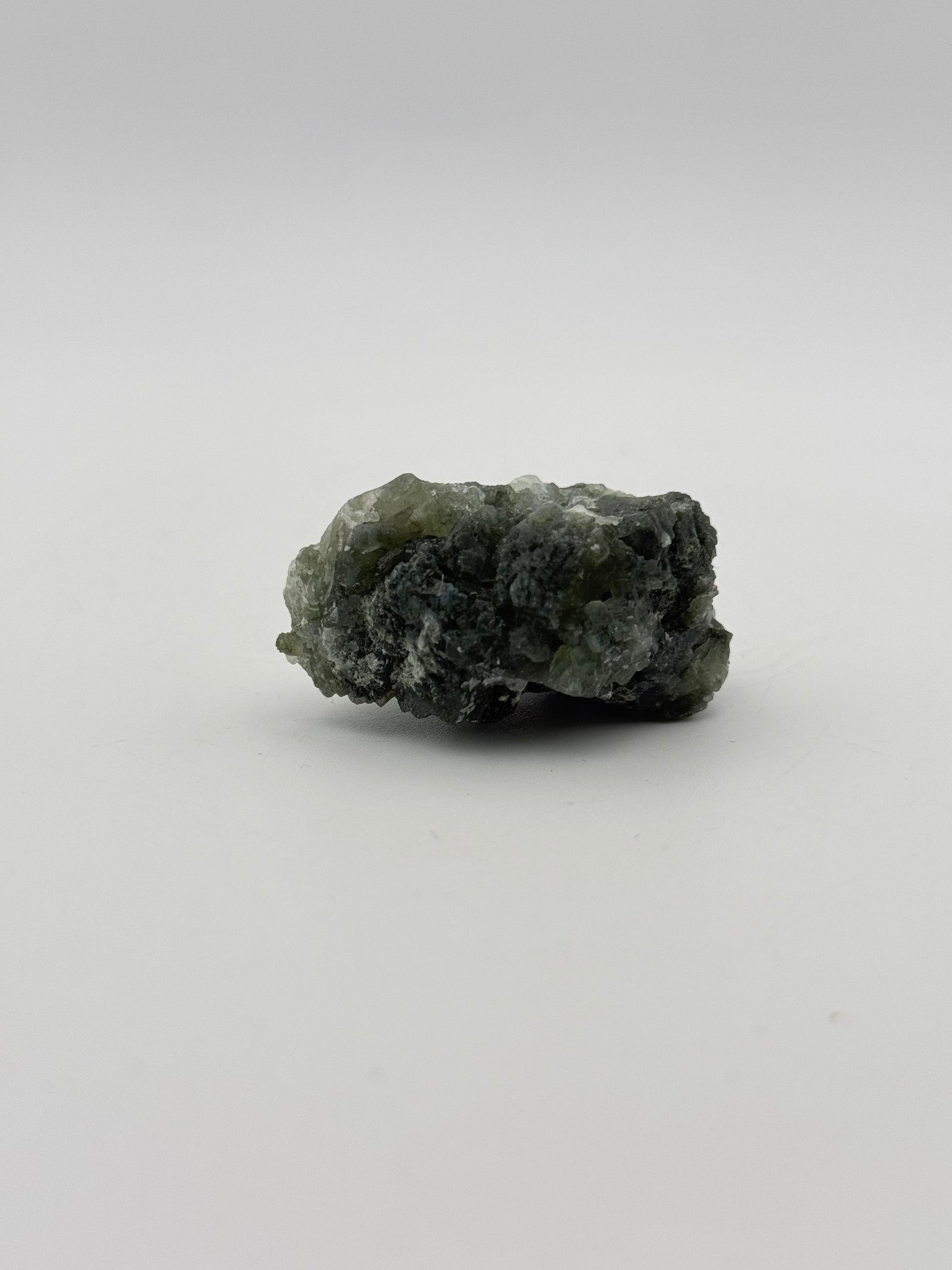 Raw Prehnite specimen with amazing green color.