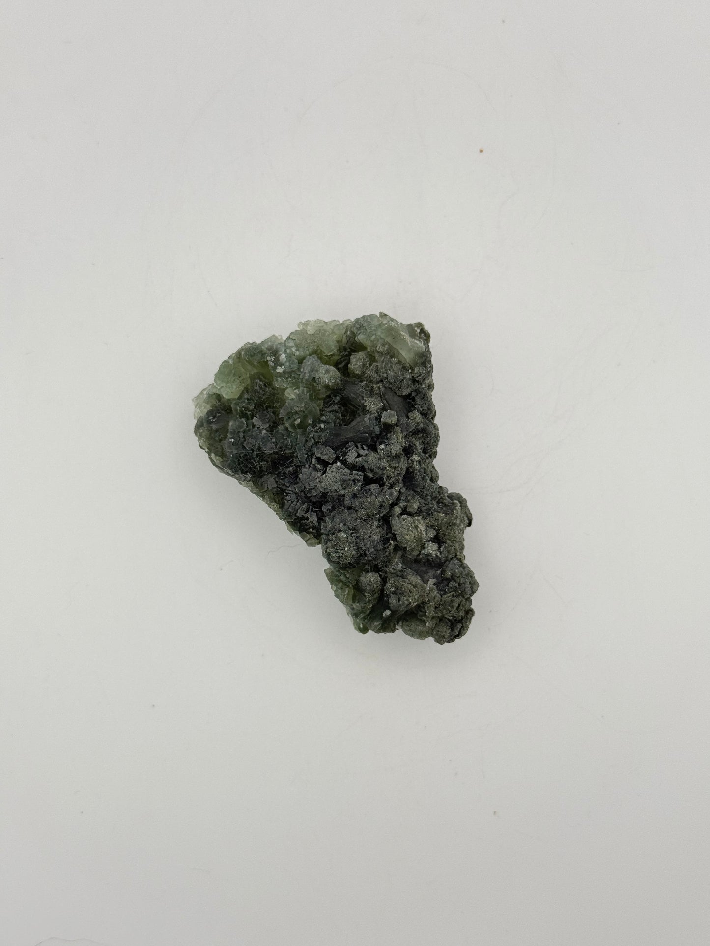 Raw Prehnite specimen with amazing green color.