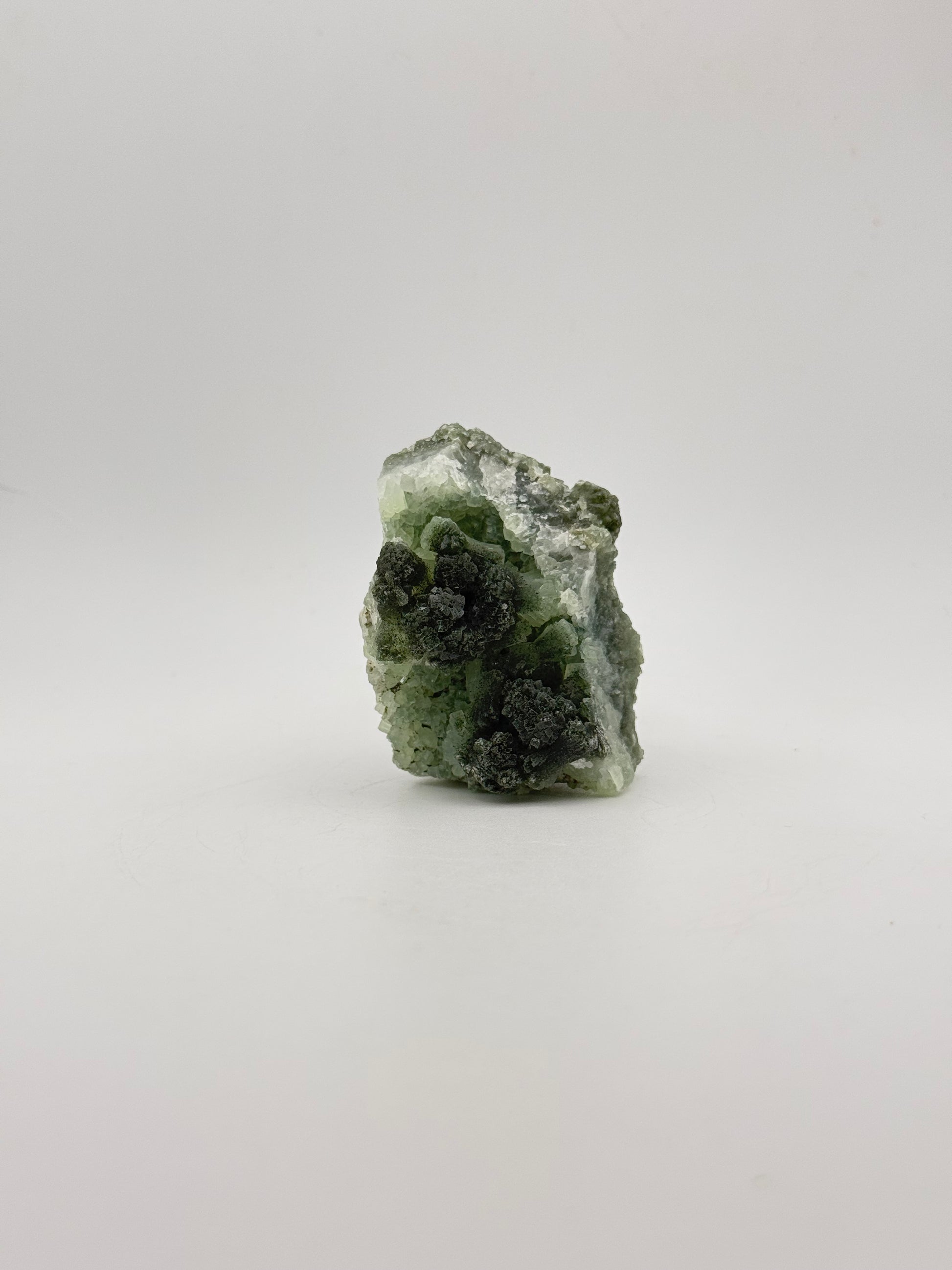 Raw Prehnite specimen with amazing green color.