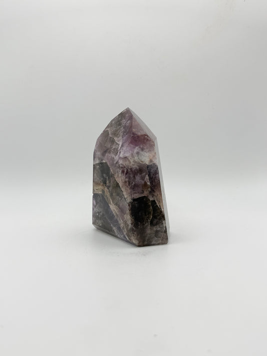 Polished super 7 in the shape of a tower.