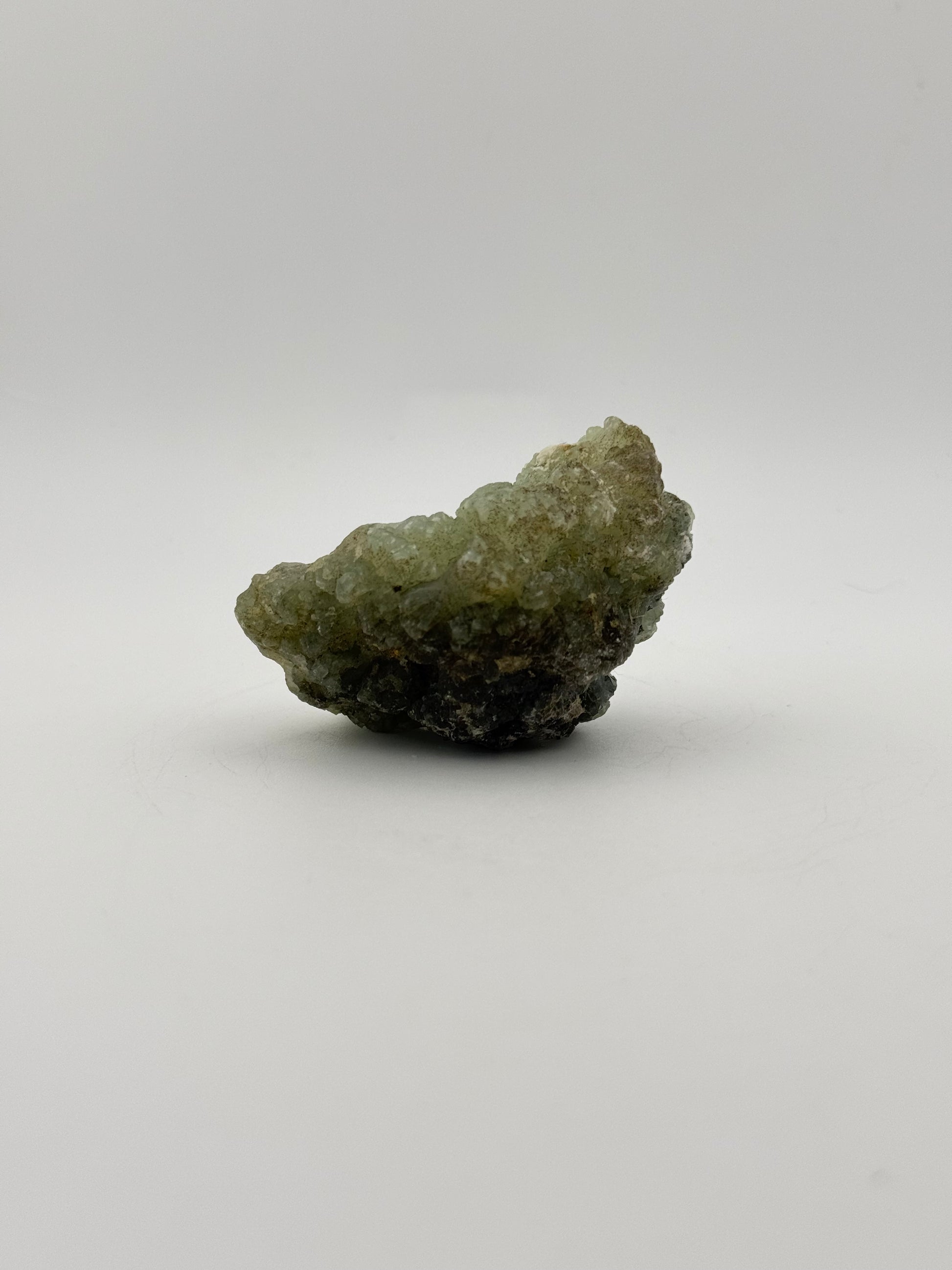 Raw Prehnite specimen with amazing green color.