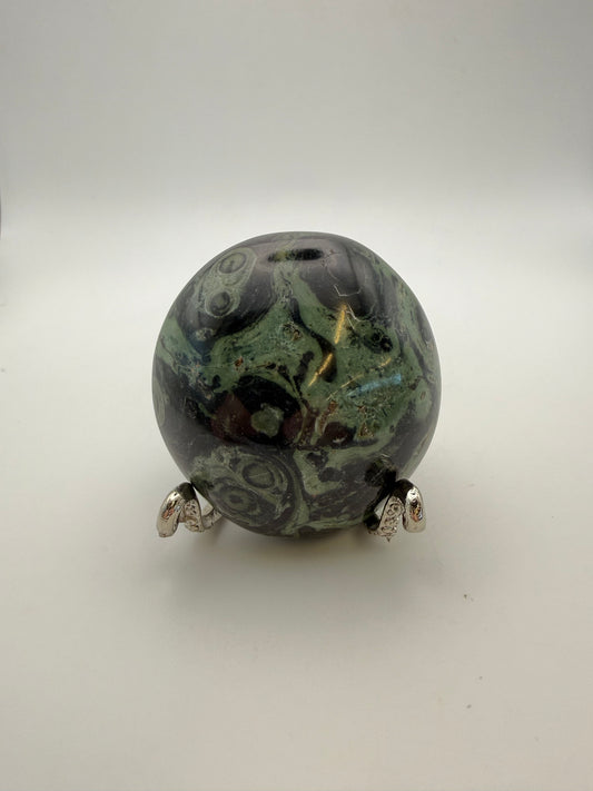 Polished kambaba jasper palm stone.