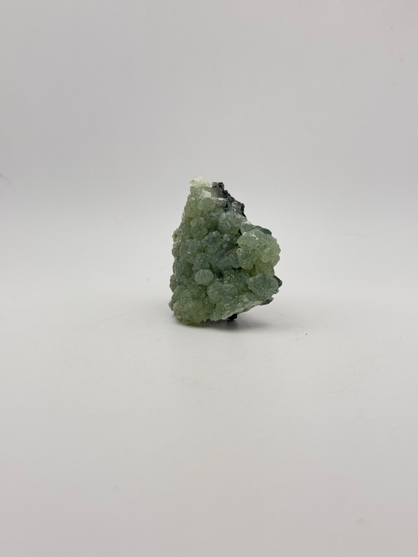 Raw Prehnite specimen with amazing green color.