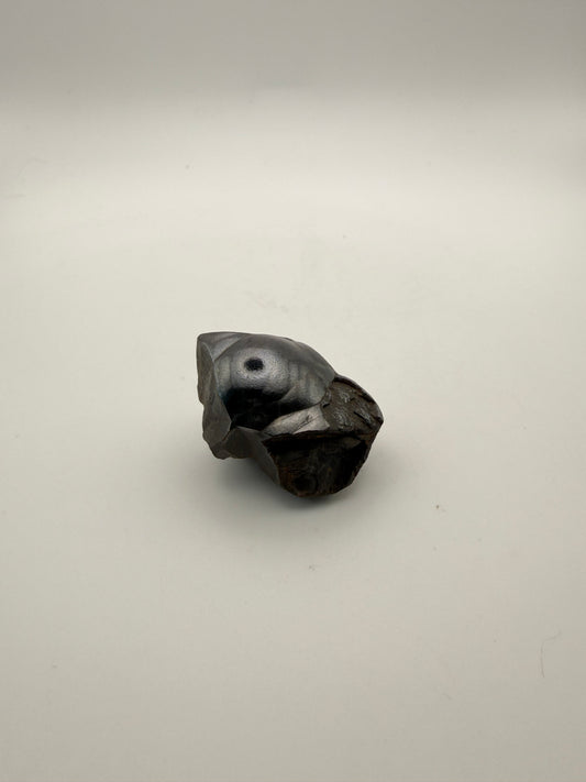Small raw hematite specimen.