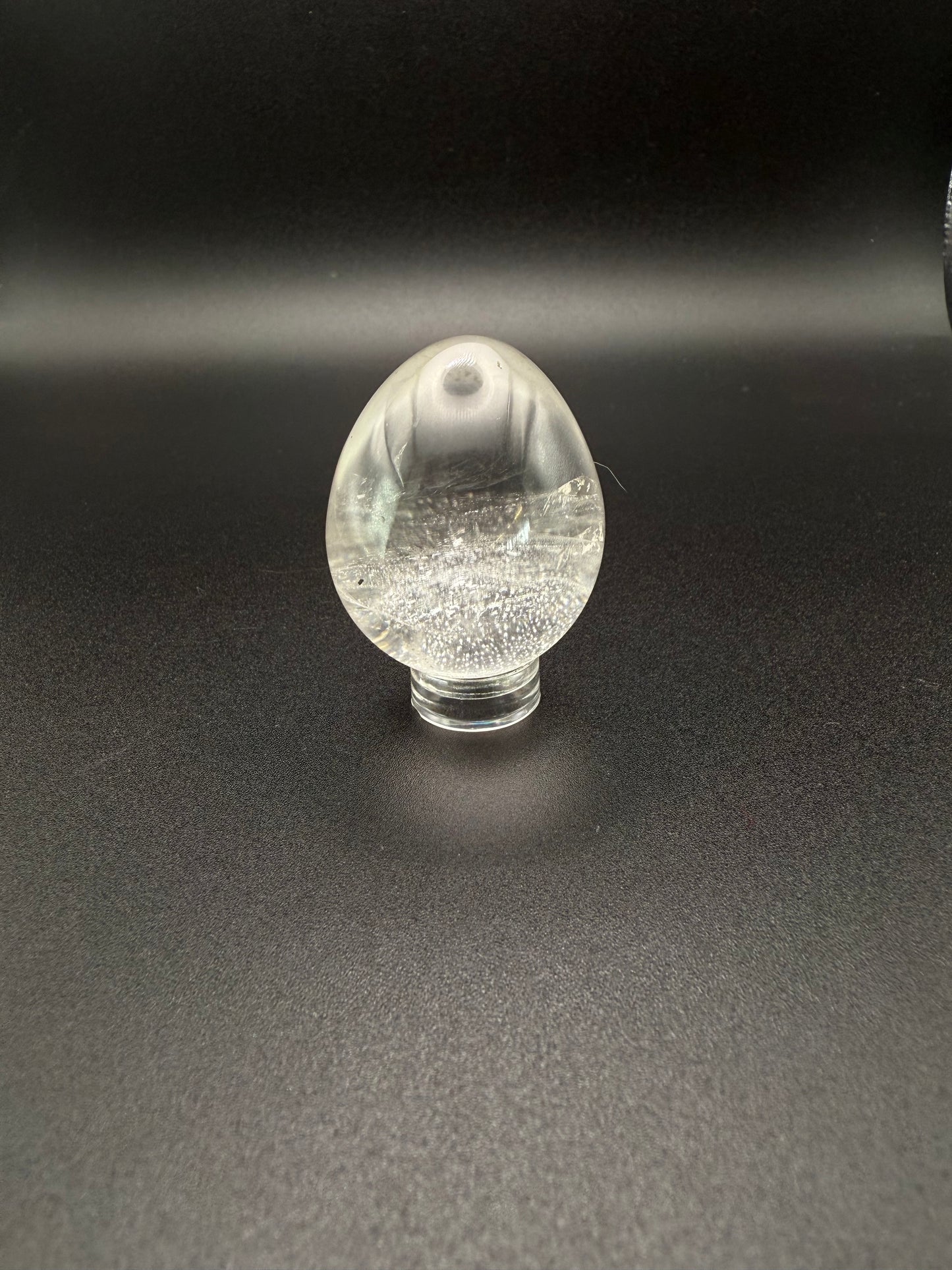 Clear quartz polished crystal in the shape of an egg.