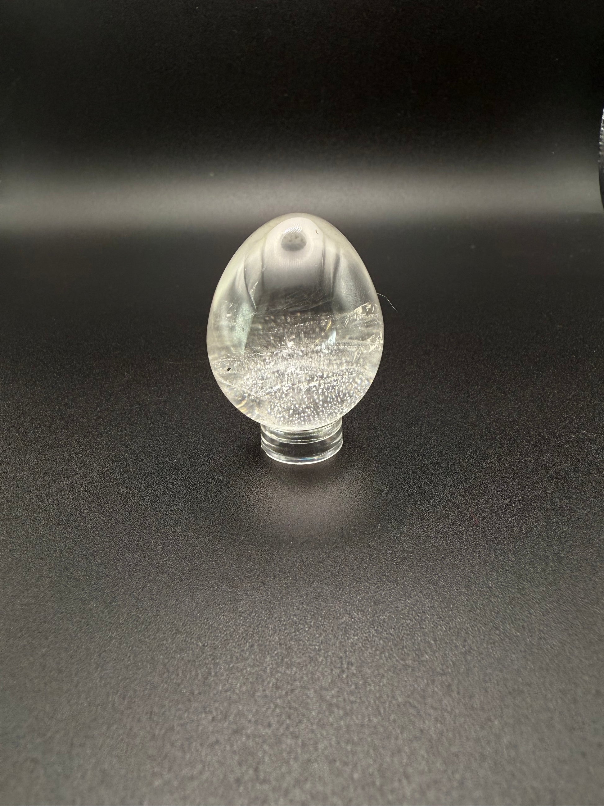Clear quartz polished crystal in the shape of an egg.