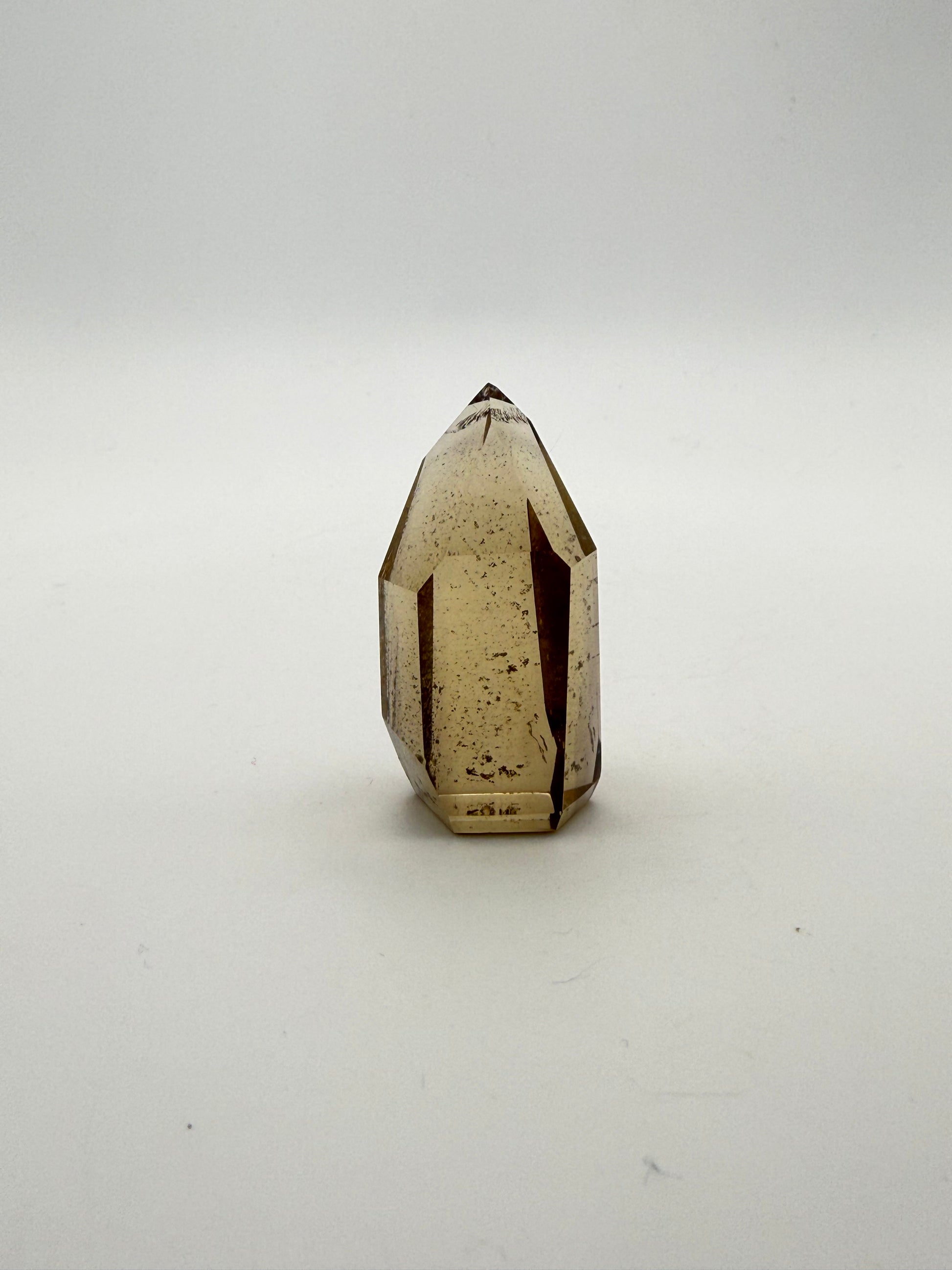 Polished natural citrine point.