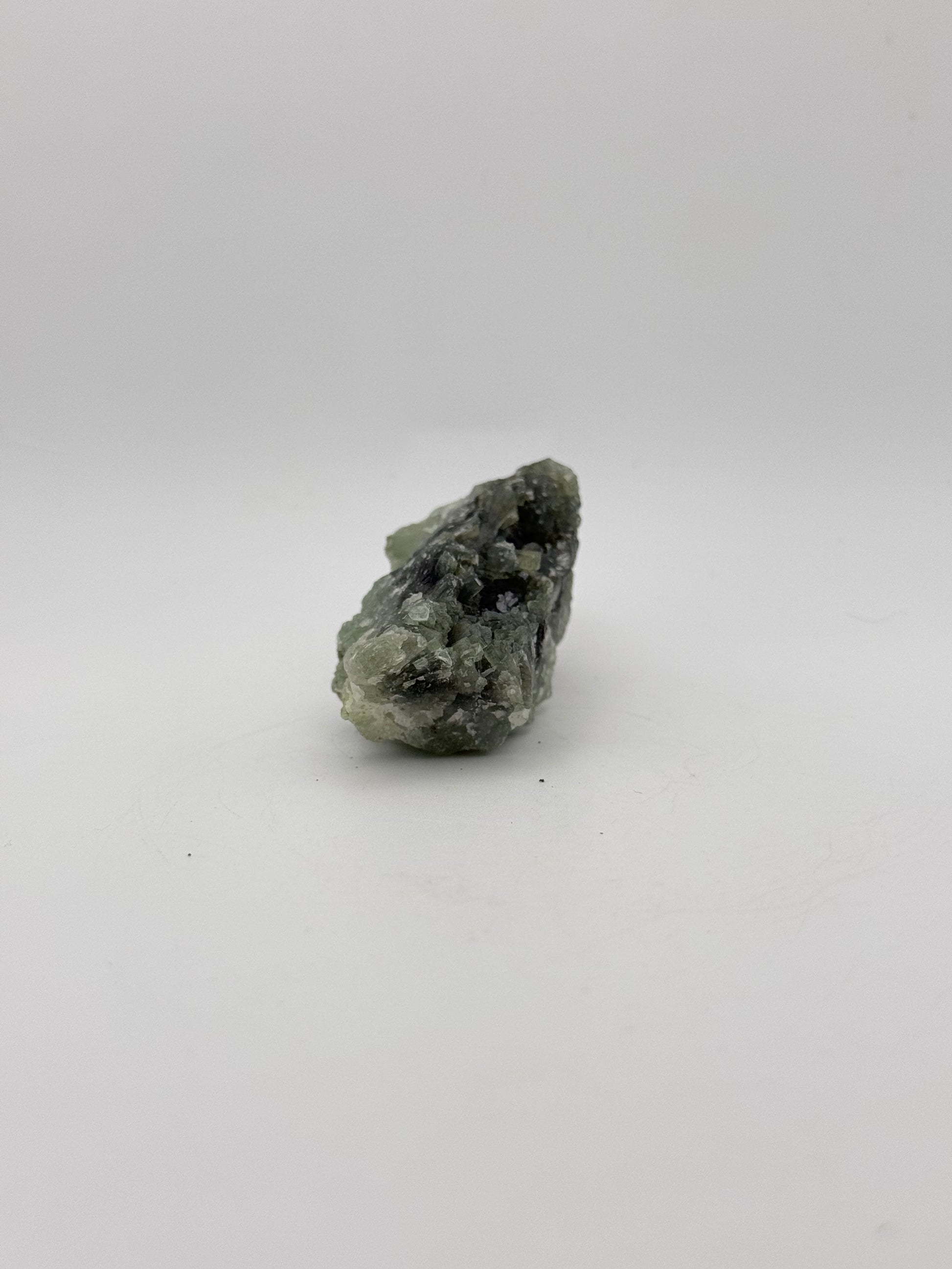 Raw Prehnite specimen with amazing green color.