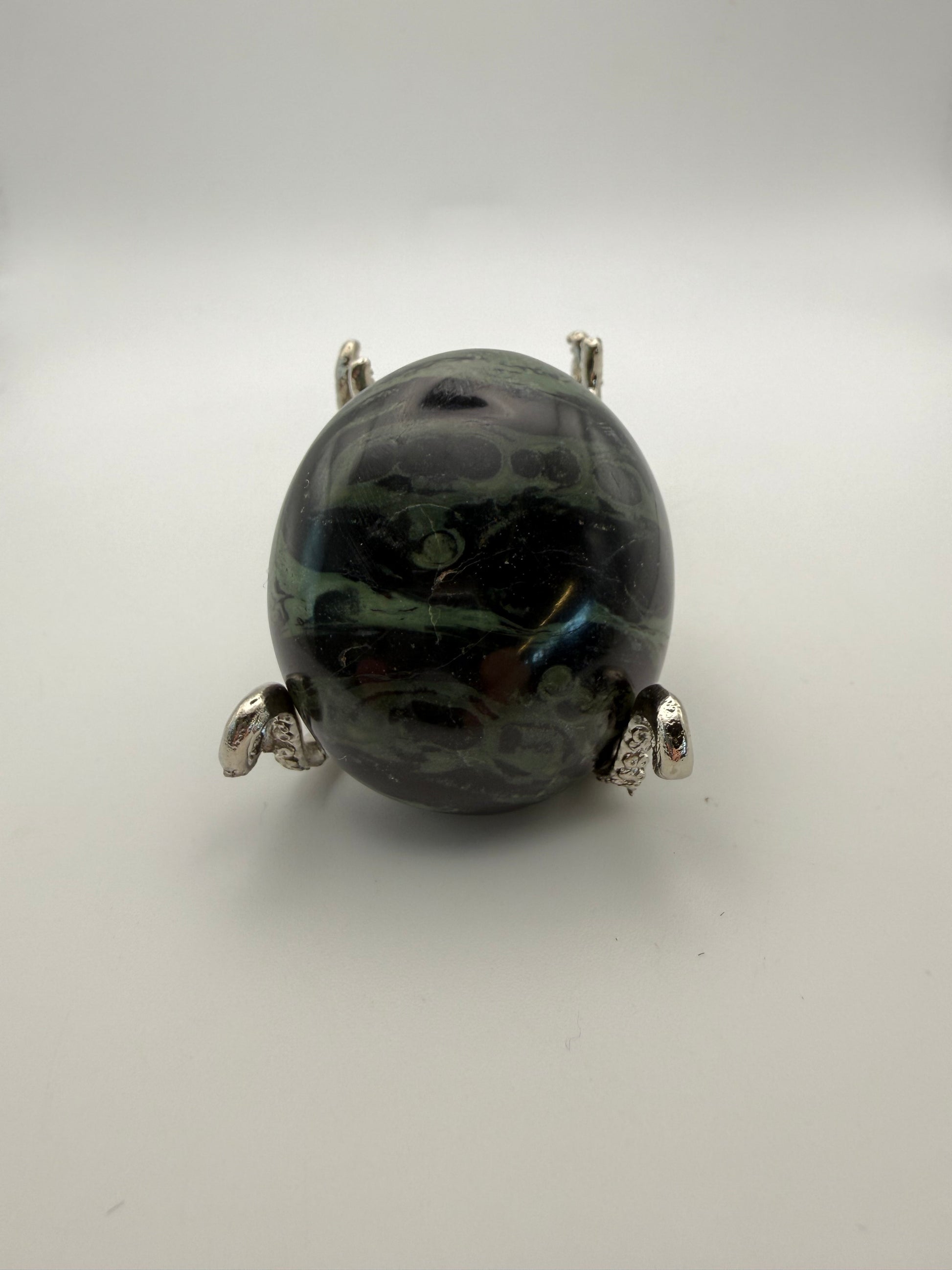 Polished kambaba jasper palm stone.