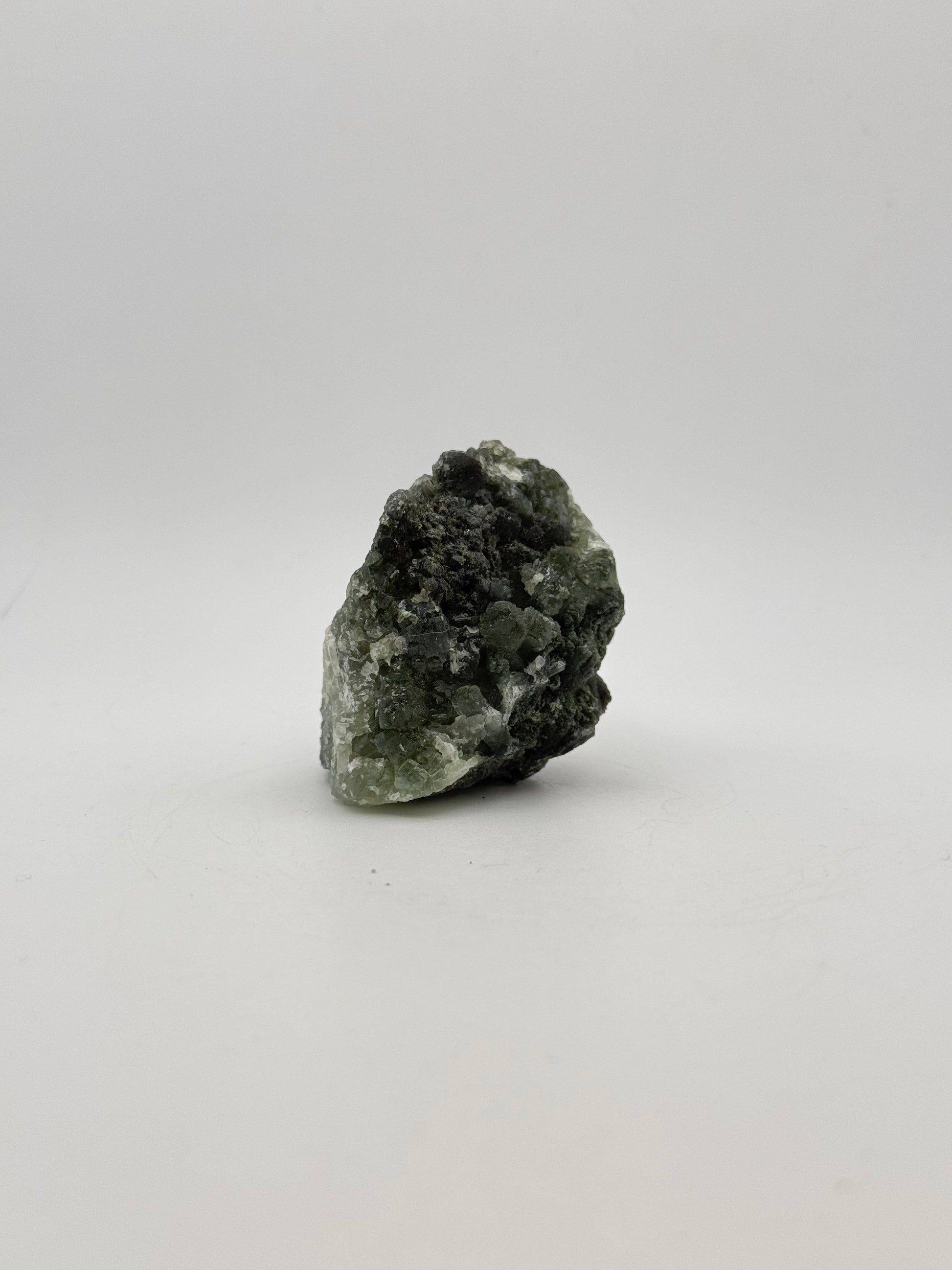 Raw Prehnite specimen with amazing green color.