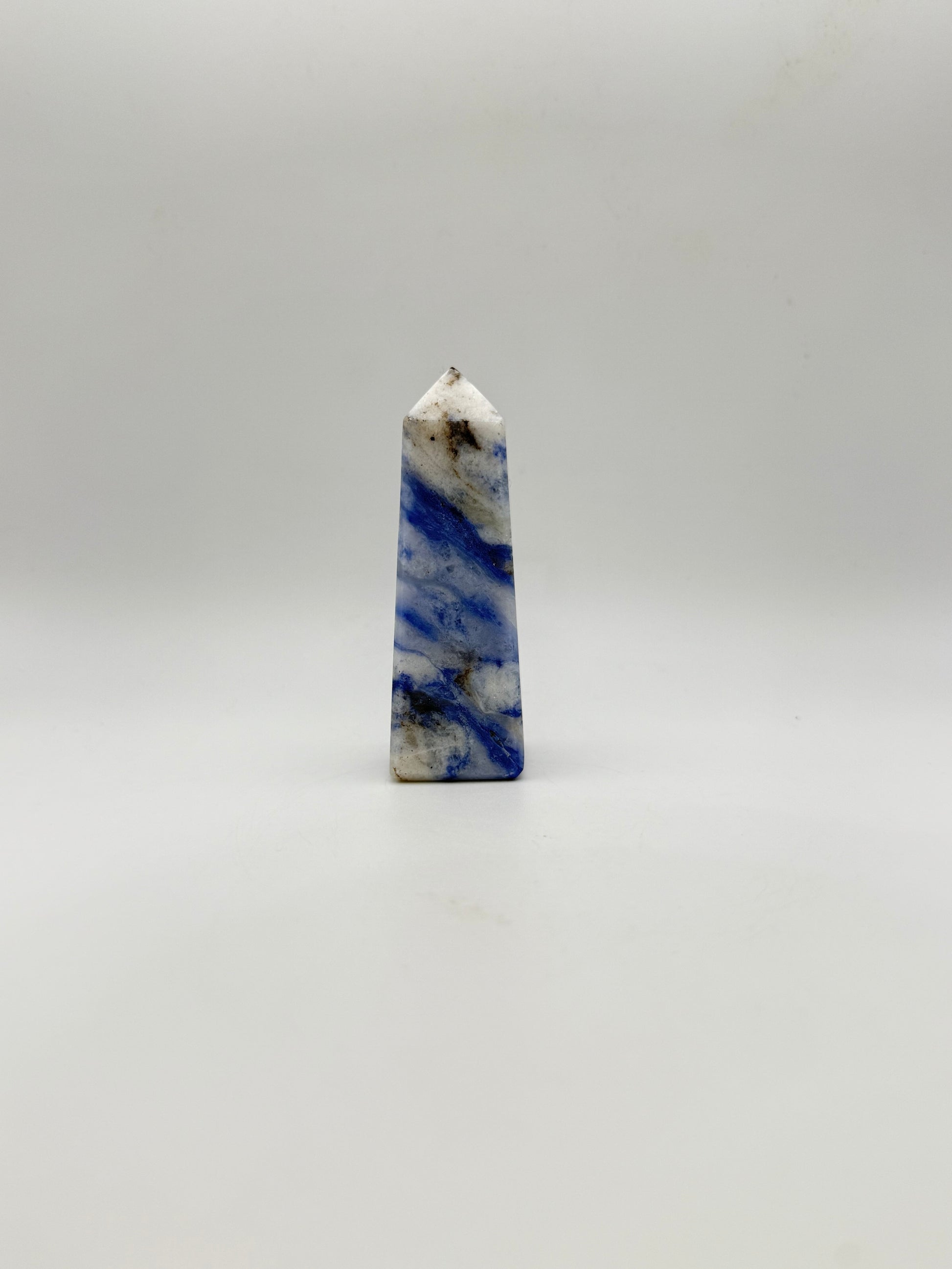 Afghanite four sided tower. Height of 3 1/4 inches, width of 1 1/4 inches.