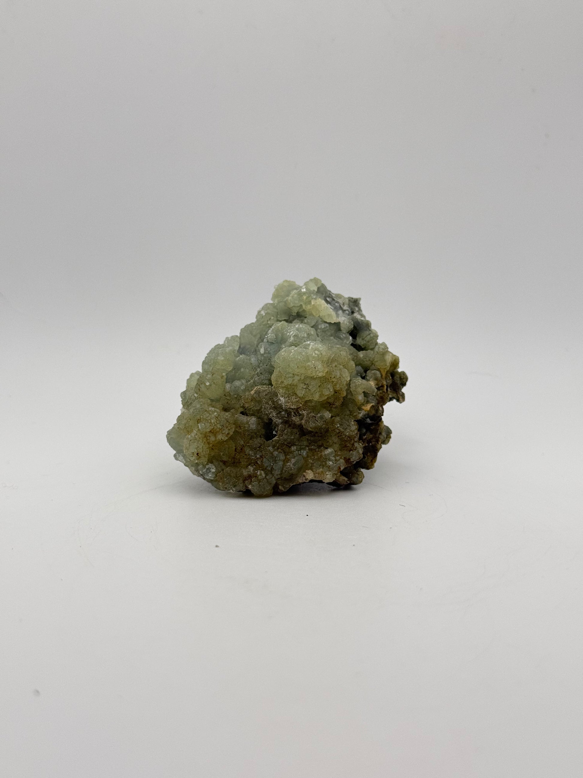 Raw Prehnite specimen with amazing green color.