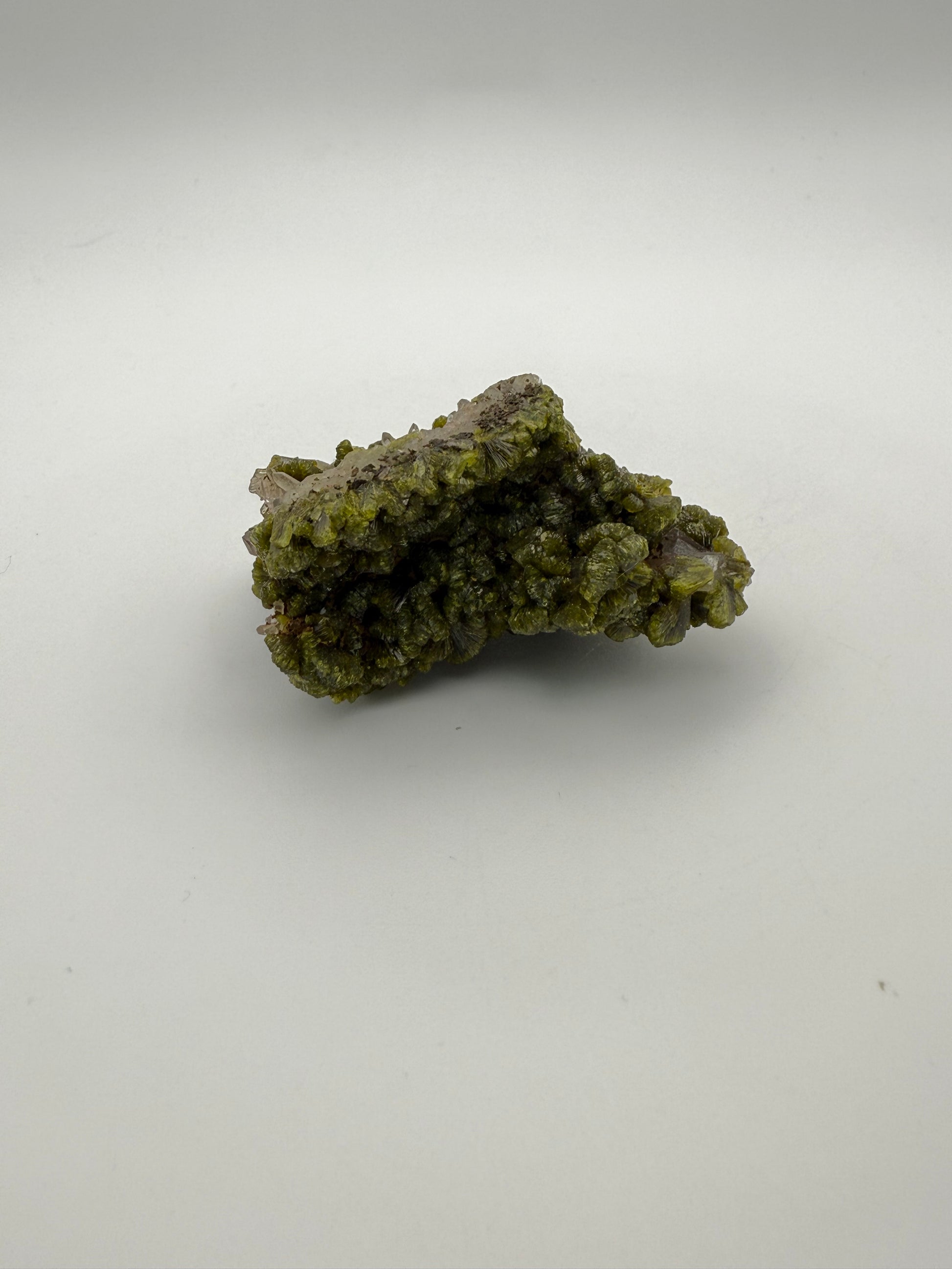 Epidote crystal cluster with good green color.