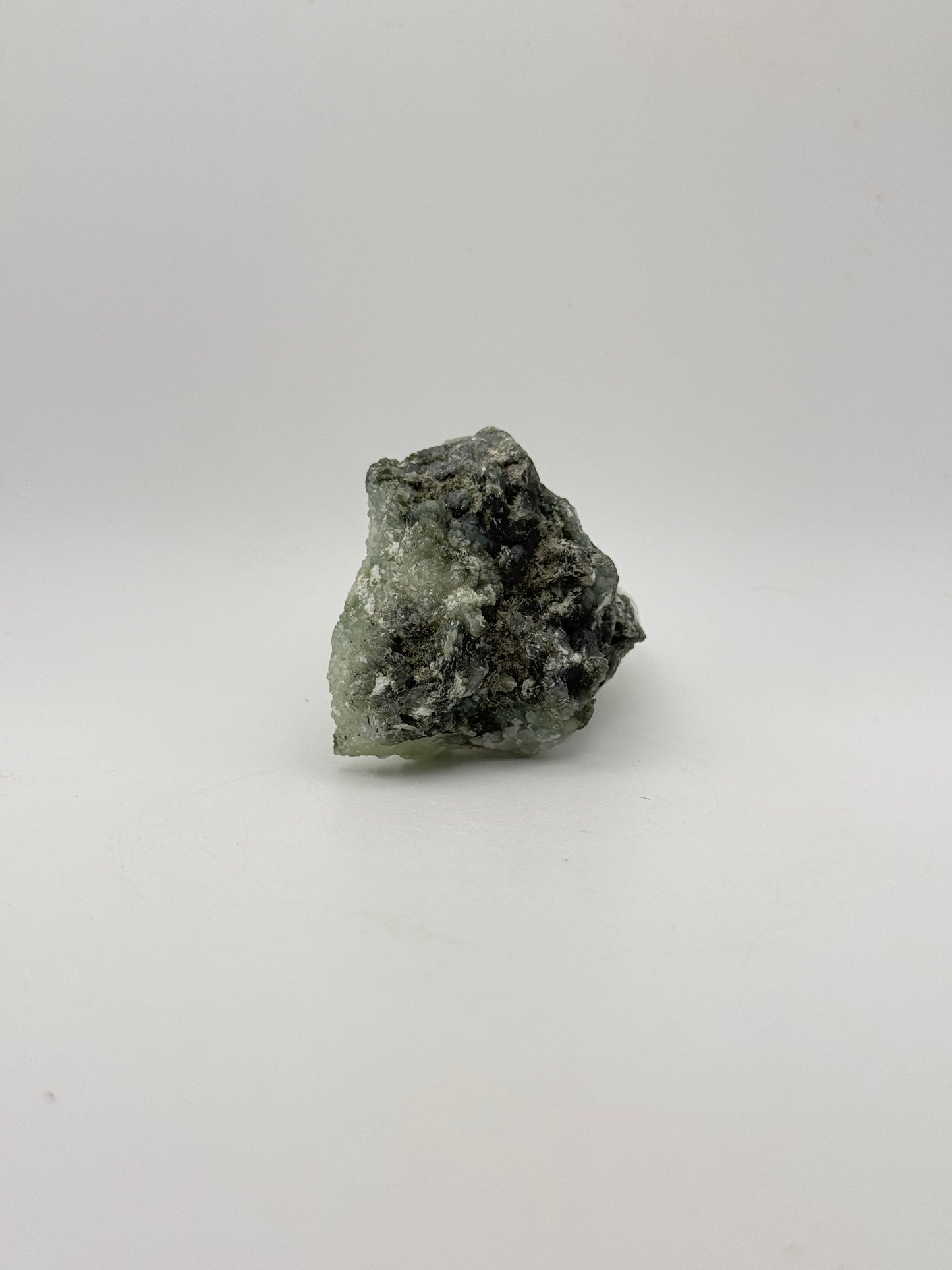 Raw Prehnite specimen with amazing green color.