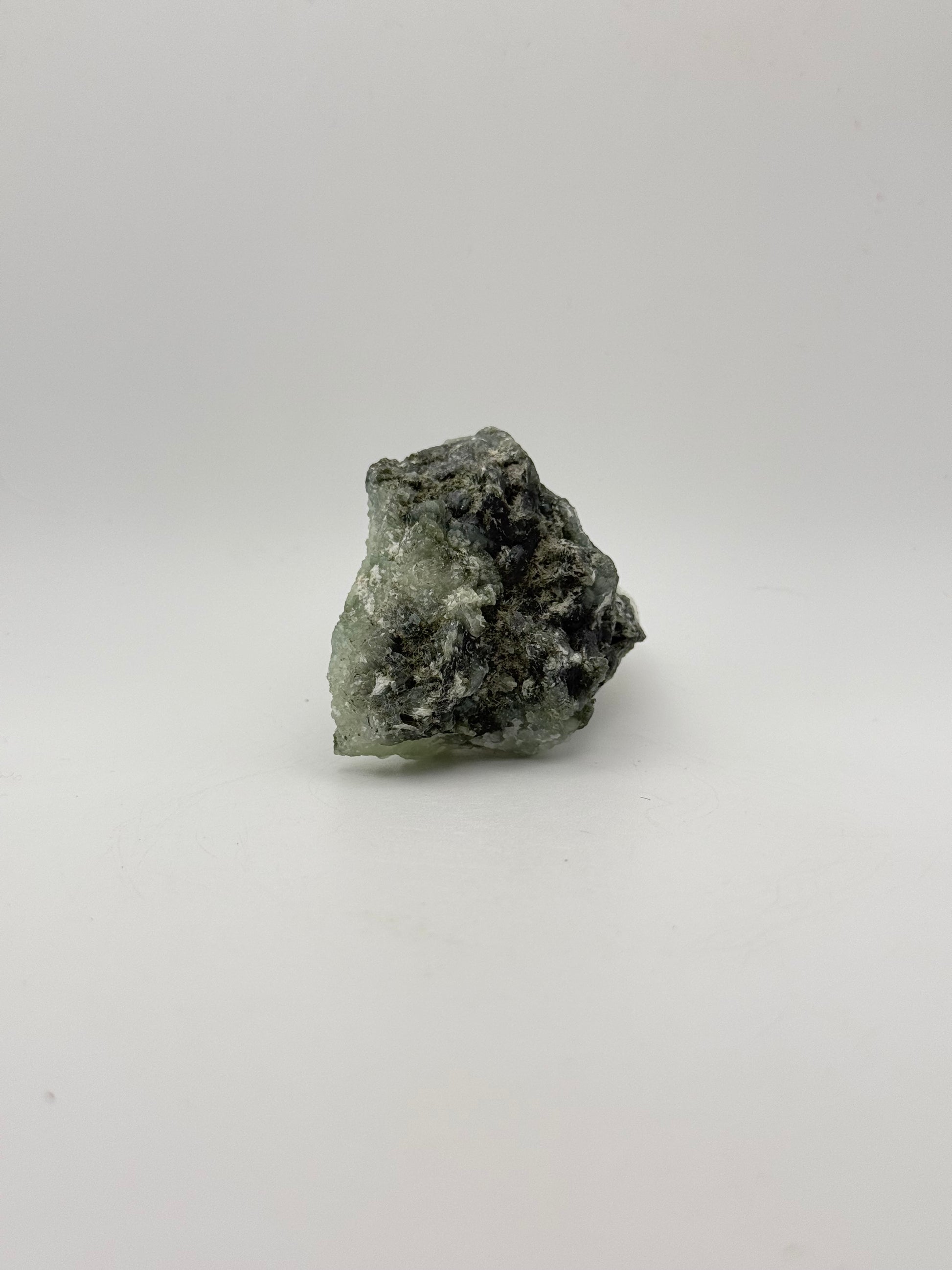 Raw Prehnite specimen with amazing green color.