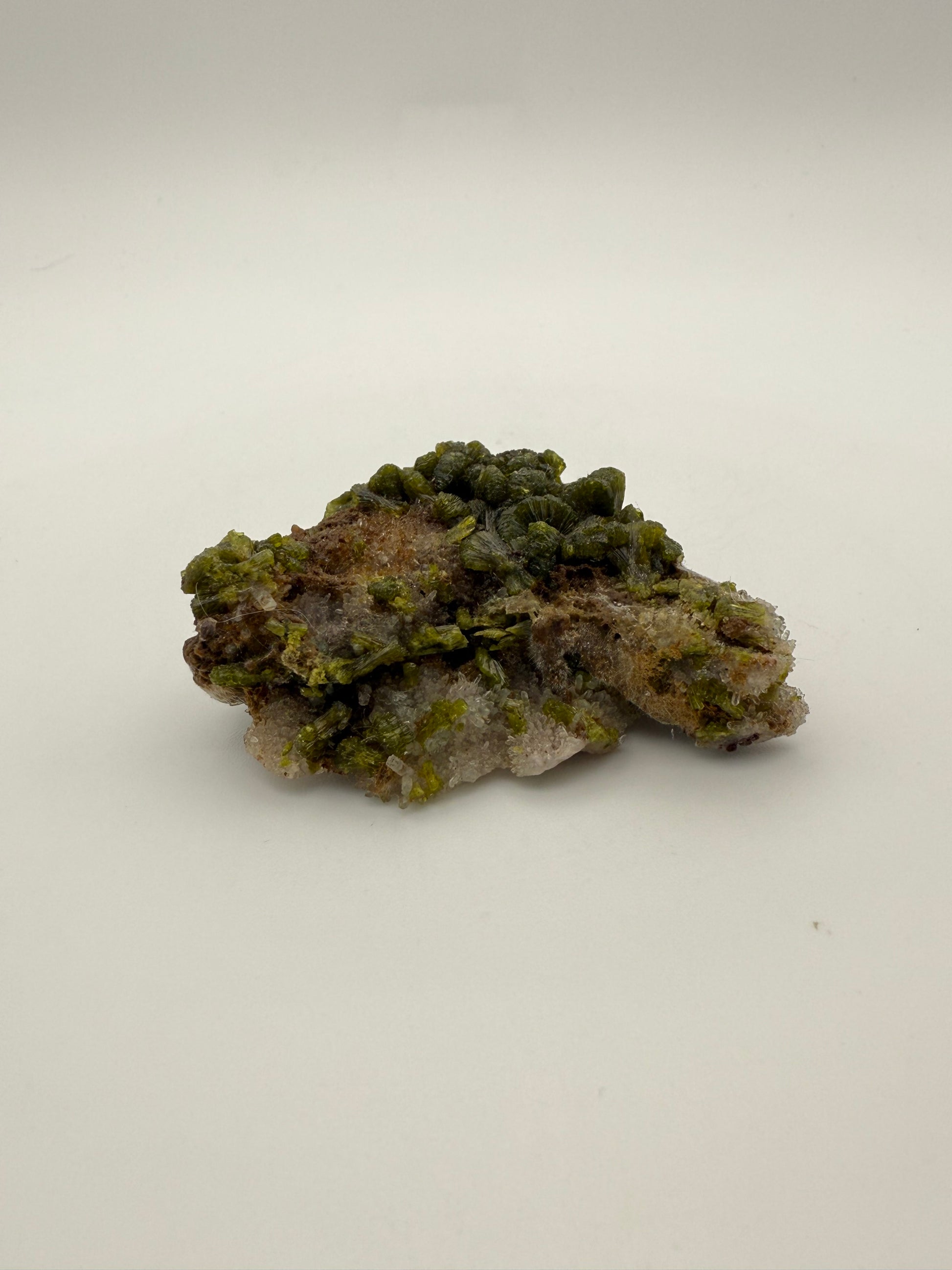 Epidote crystal cluster with good green color.