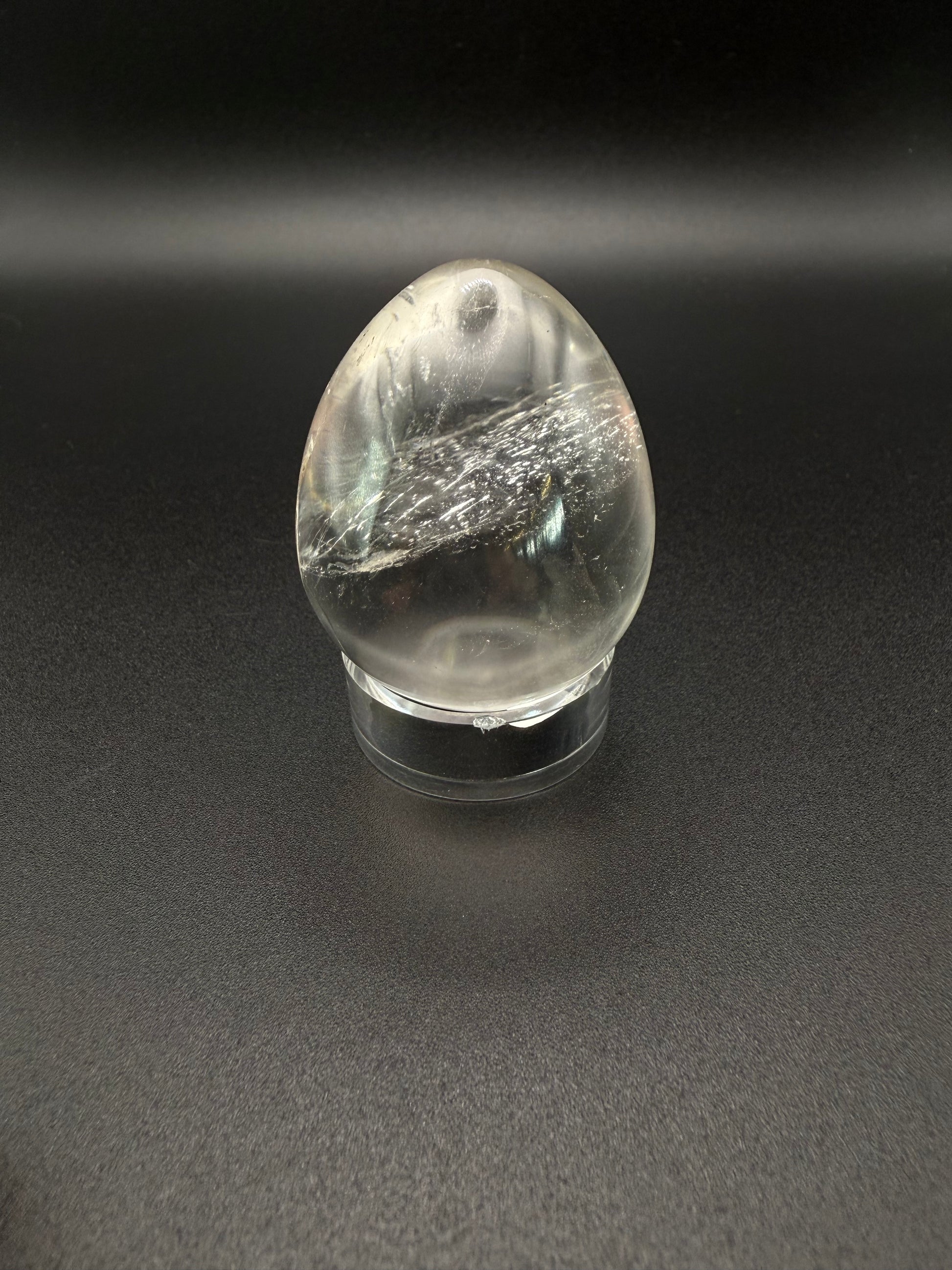 Clear quartz polished crystal in an egg shape.