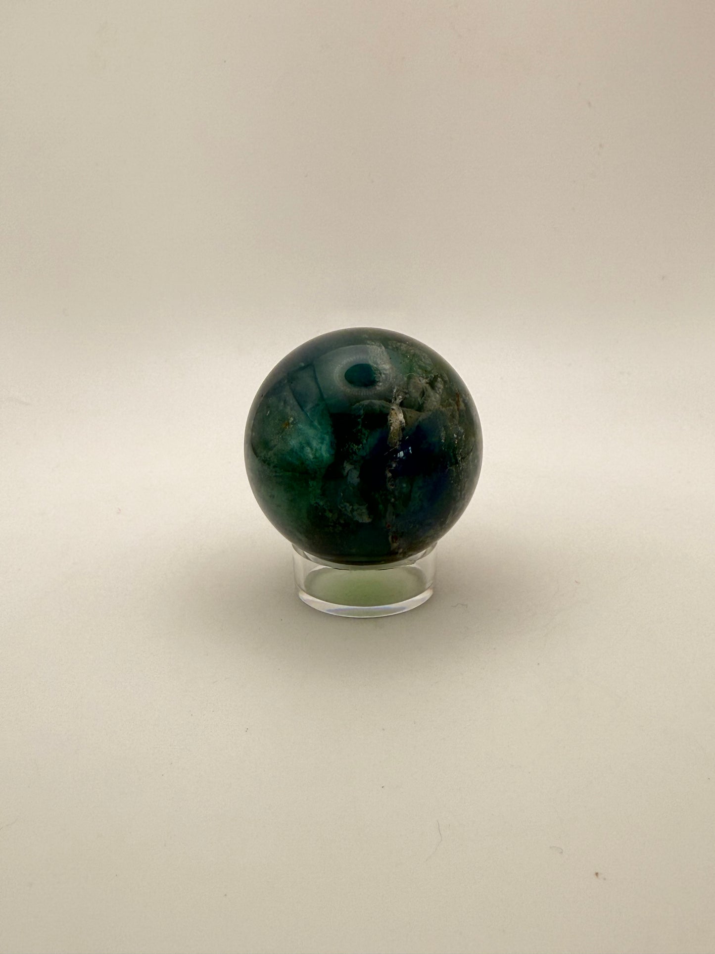 Rainbow Fluorite polished crystal sphere.