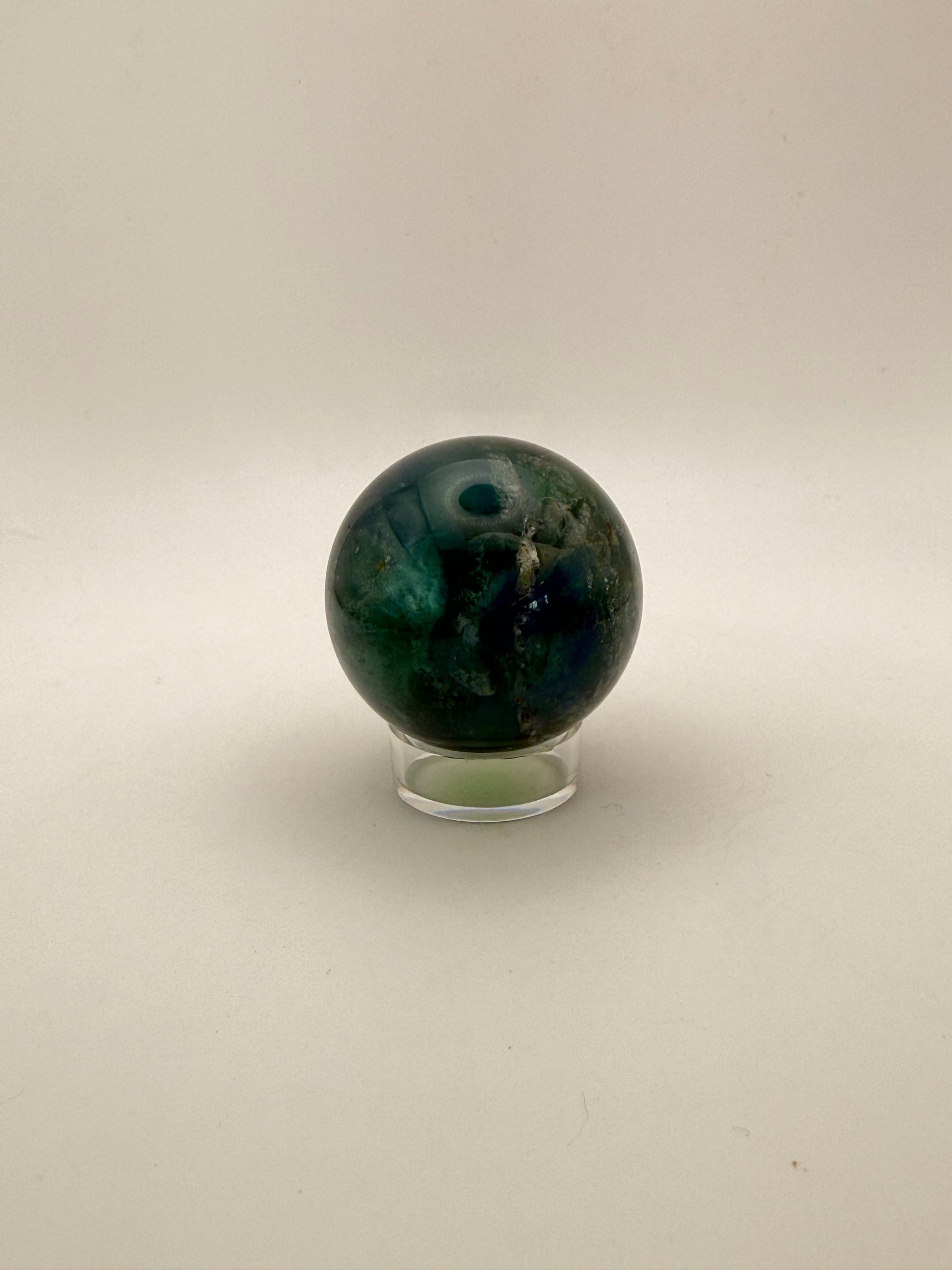 Rainbow Fluorite polished crystal sphere.
