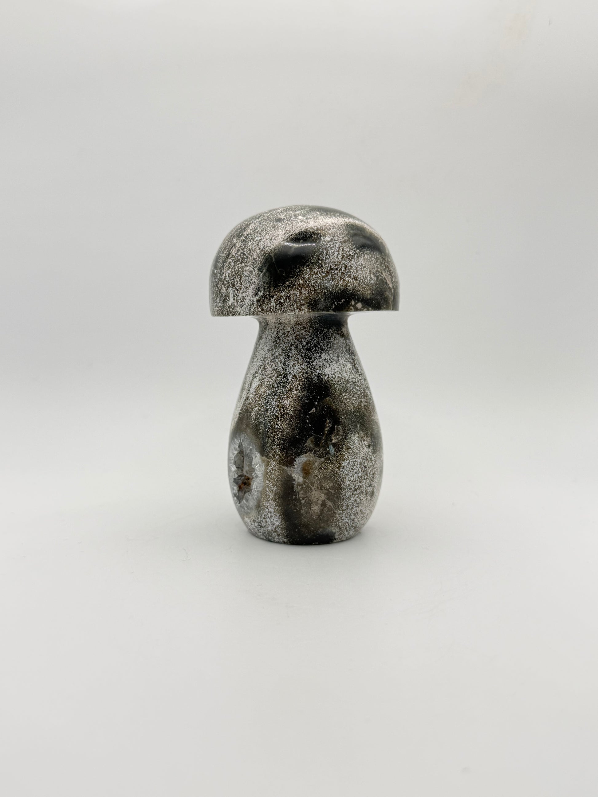 Ocean jasper stone in the shape of a mushroom.